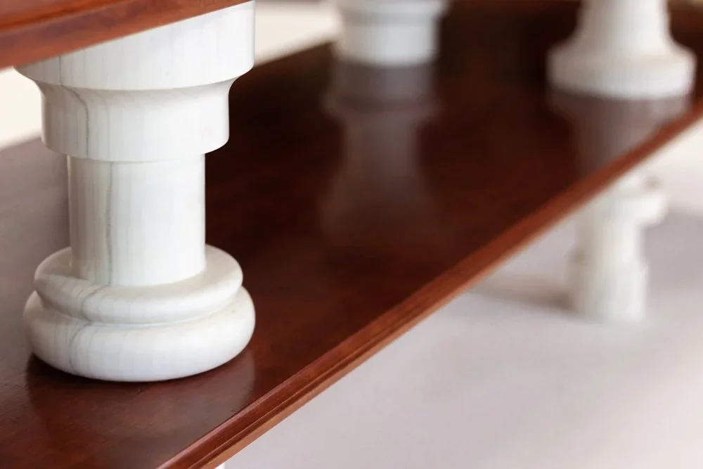 A custom furniture cabinet with turned legs