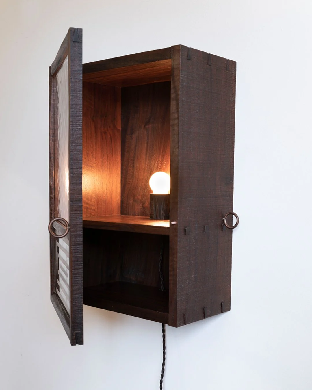 Roughsawn Walnut cabinet with Tala light