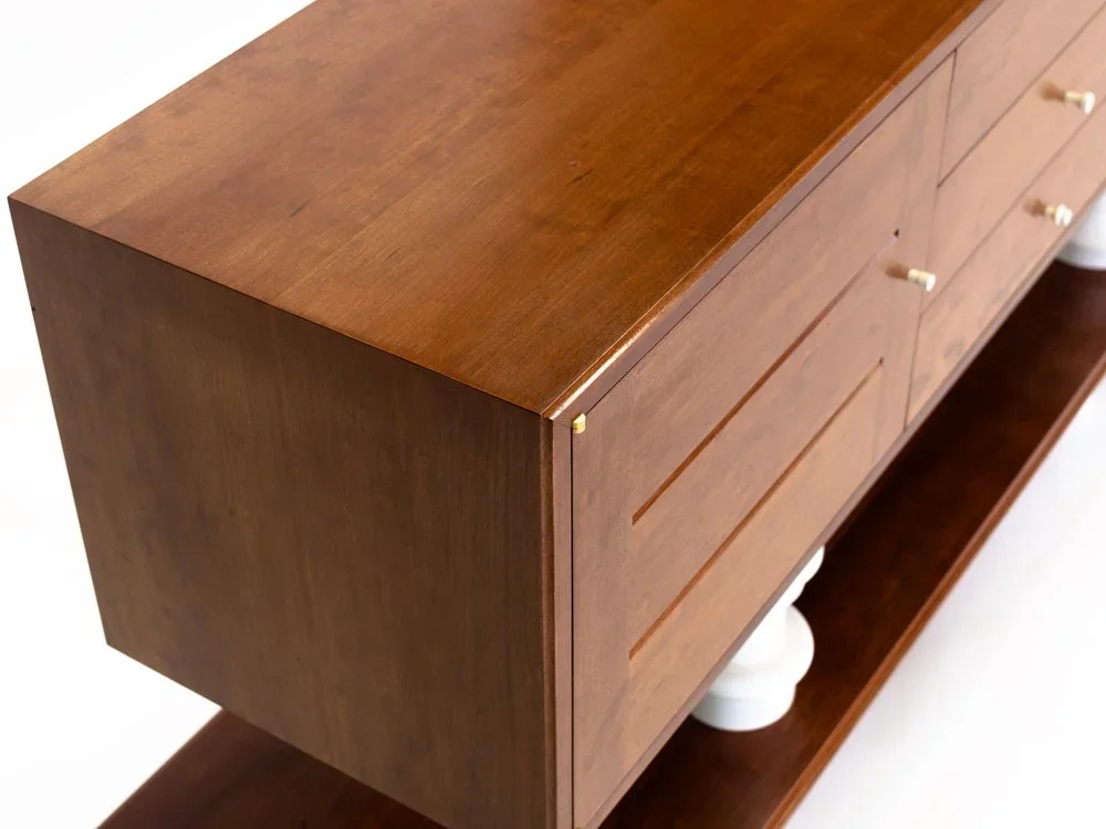 A custom furniture cabinet with turned legs