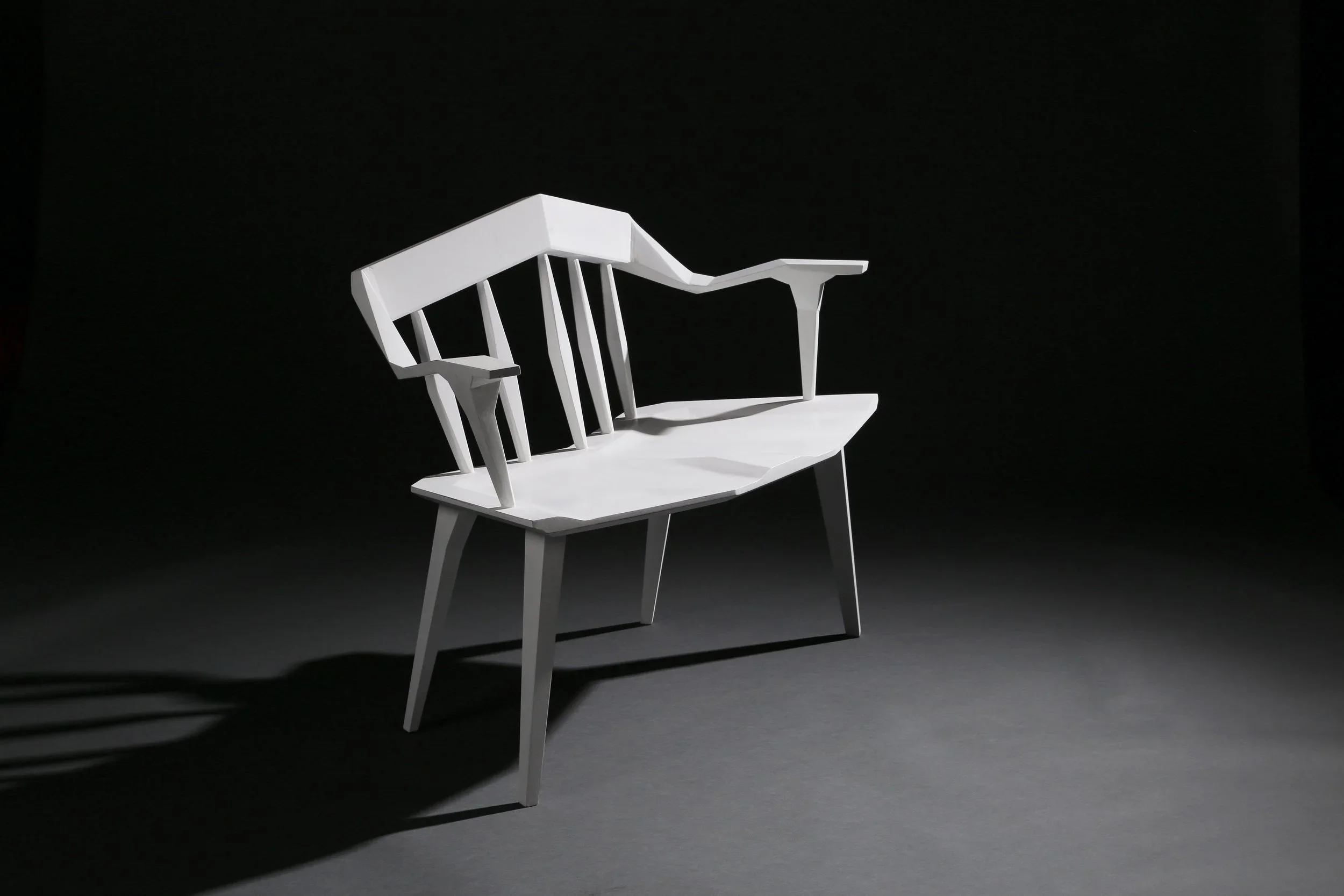 One of a pair of white angular custom furniture benches