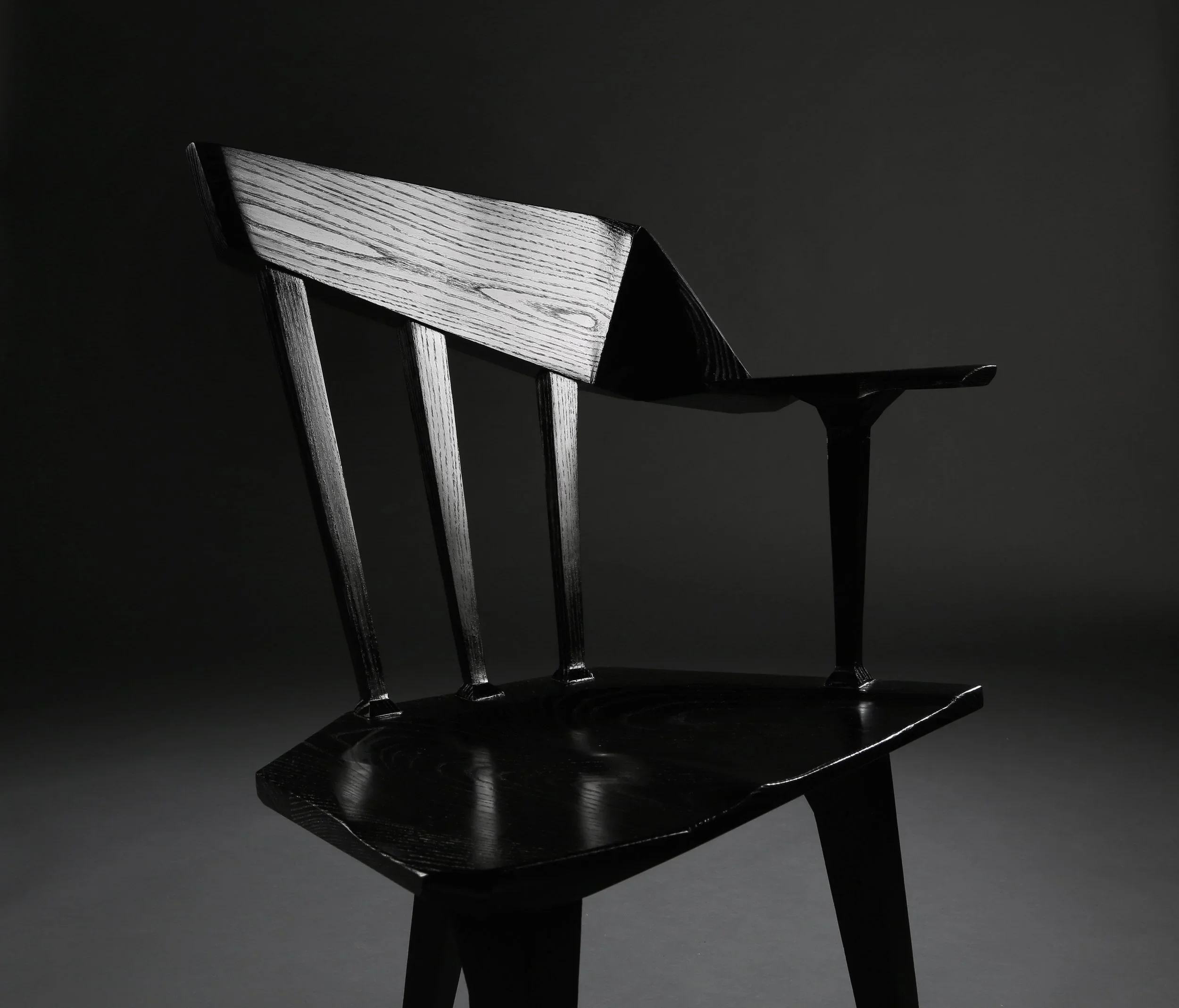 An angular black custom chair