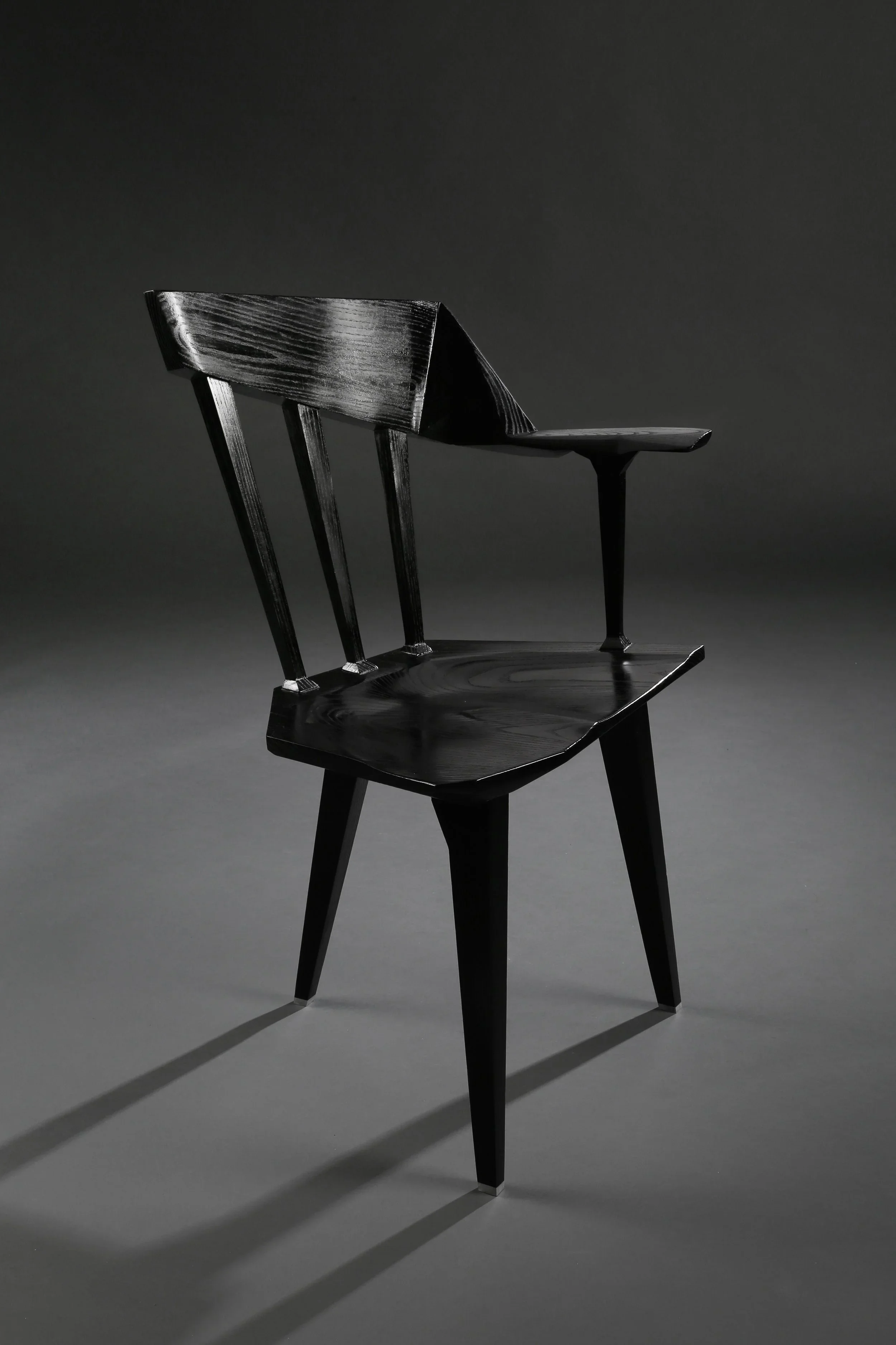 An angular black custom chair