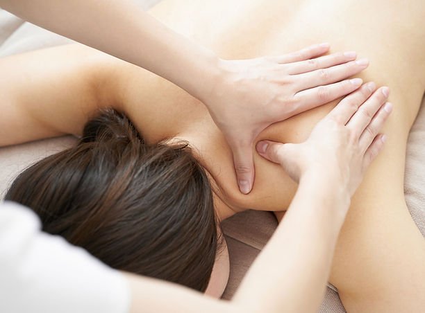 Person receiving a massage on their back.