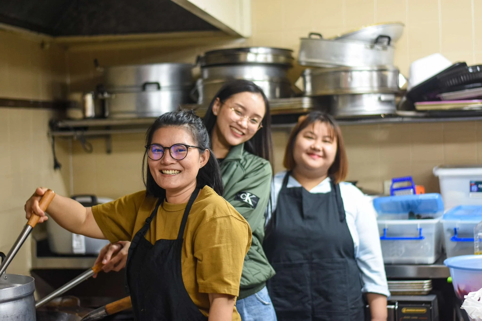 Three women cooking.