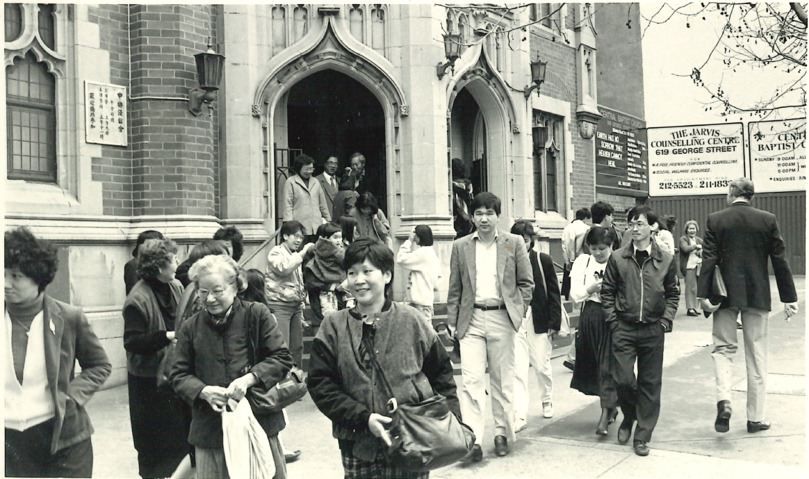 People leaving from the front of the church building
