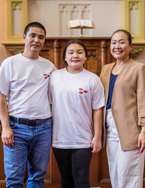 A portrait of Thai Pastor Nunthana Saicholkhongsuk and her family.