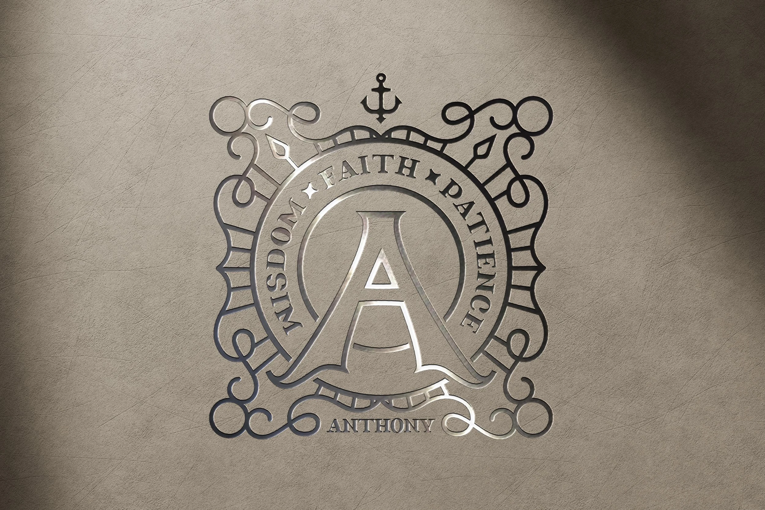 Metal emblem with the words "FAITH, HONOR, LOVE" and a large "A" in the center, surrounded by decorative curls, a crown, and an anchor, with the name "ANTHONY" at the bottom, on a beige textured surface.