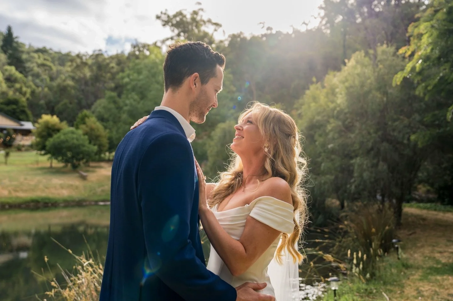 Sam &amp; Andrew by the lake on her parent&rsquo;s property in the golden hour light 💛