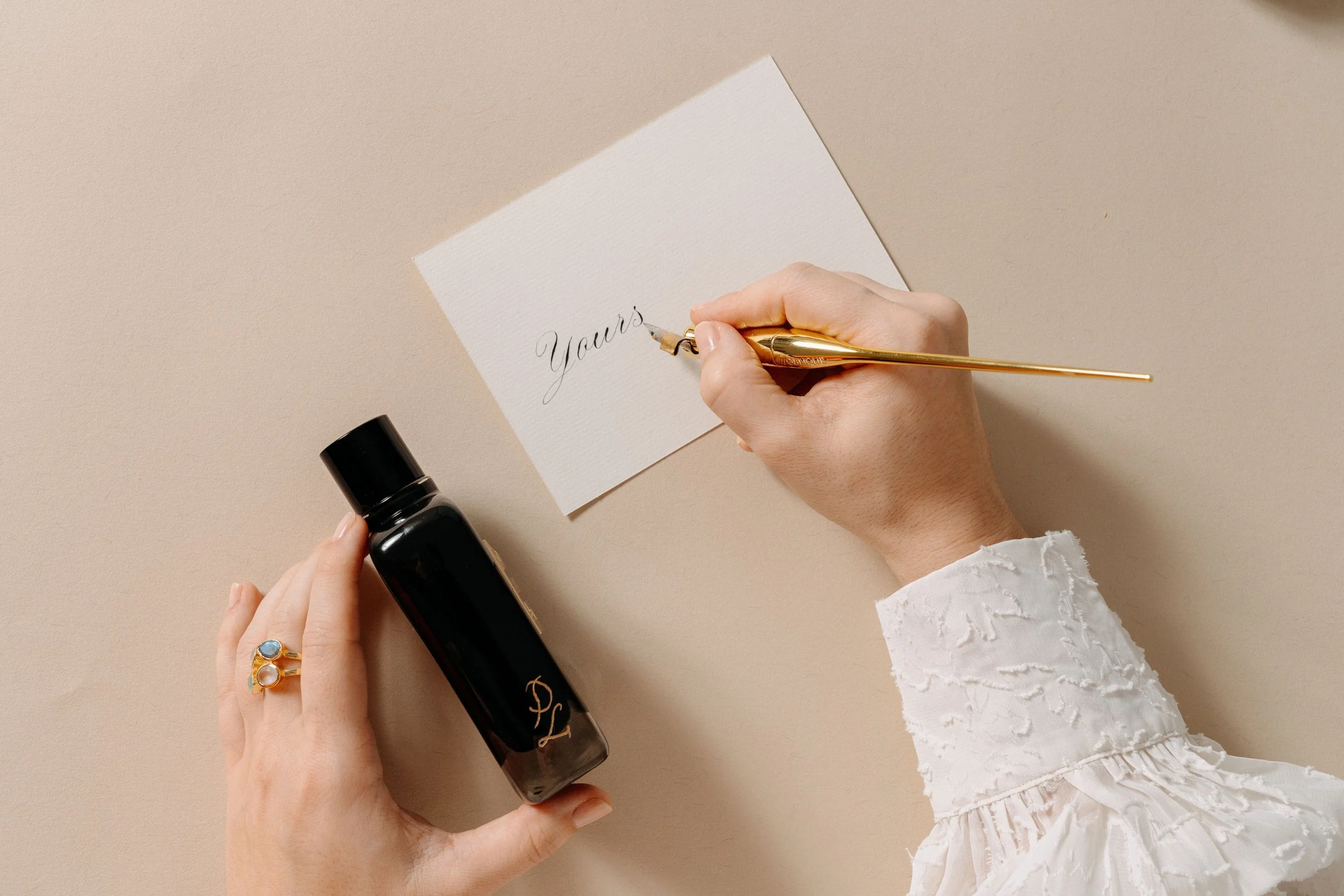 Hands writing calligraphy.jpg