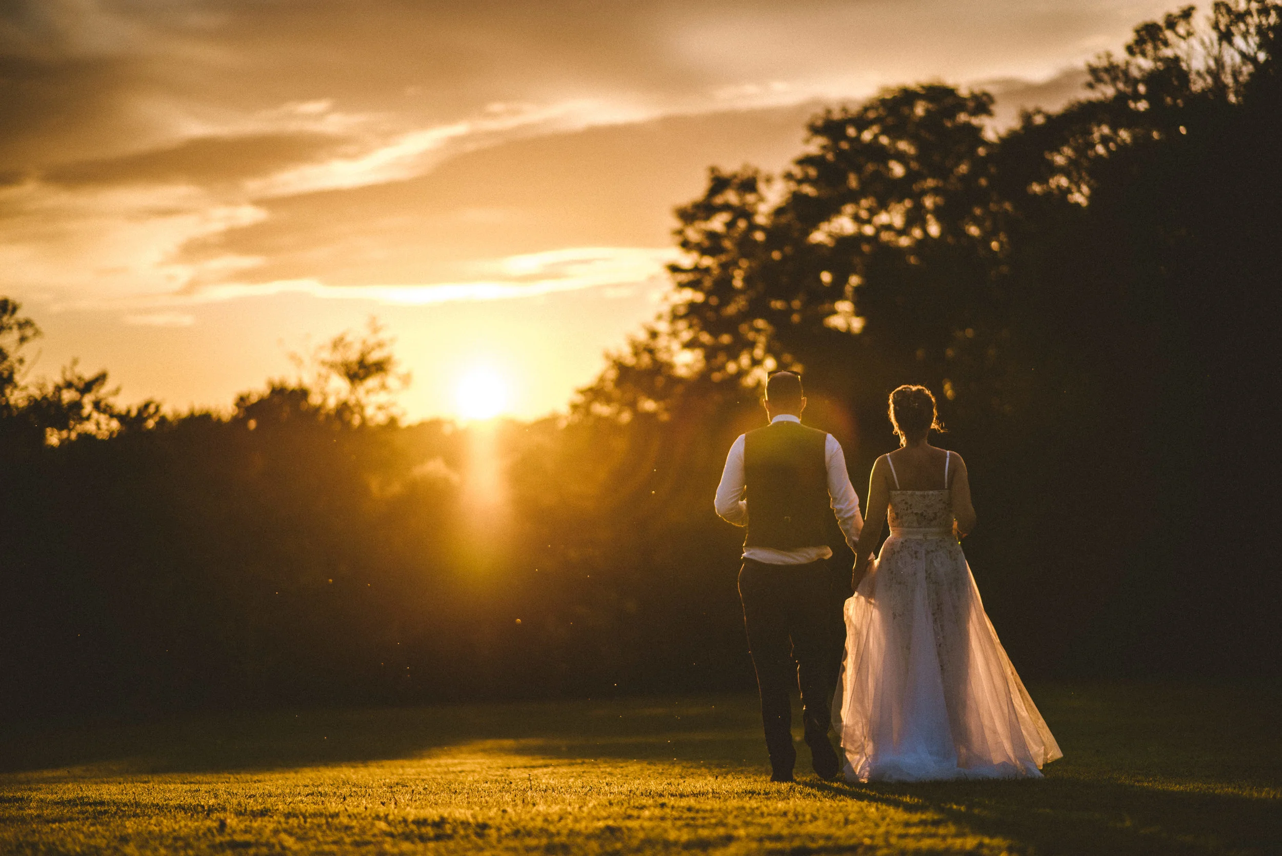 Bride and groom at Pencarrow House at sunset captured by award-winning Cornwall wedding photographer Mark Shaw