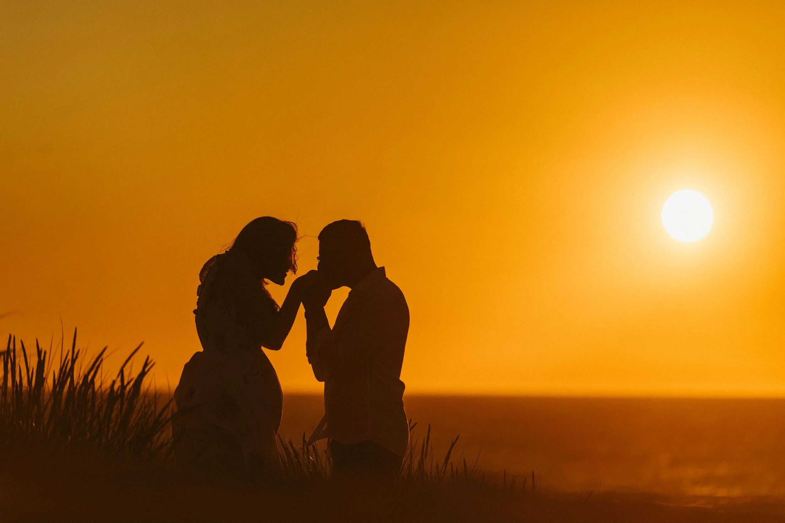 wedding couple at sunset on beach in Cornwall