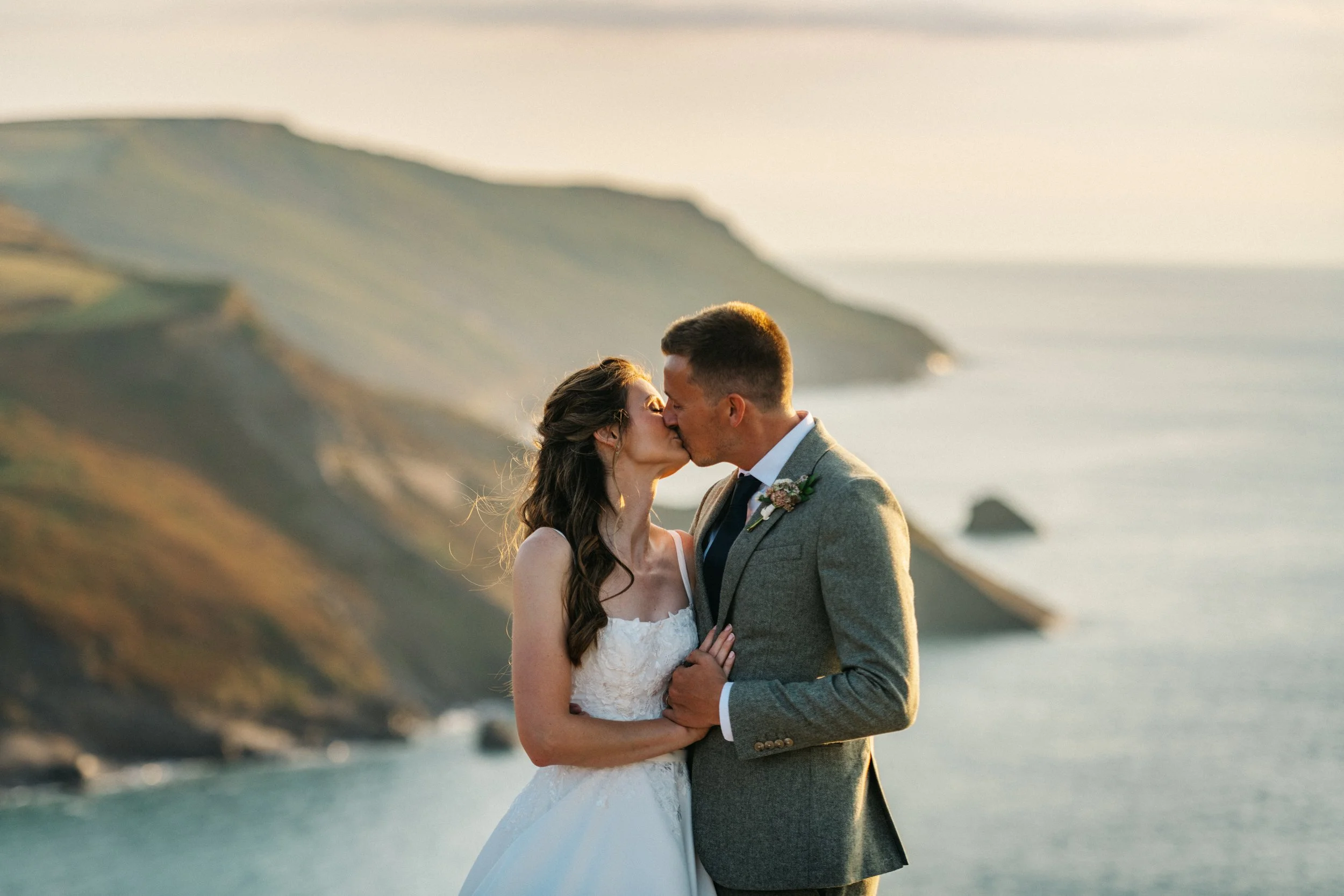 Wedding couple at golden hour on north coast of cornwall