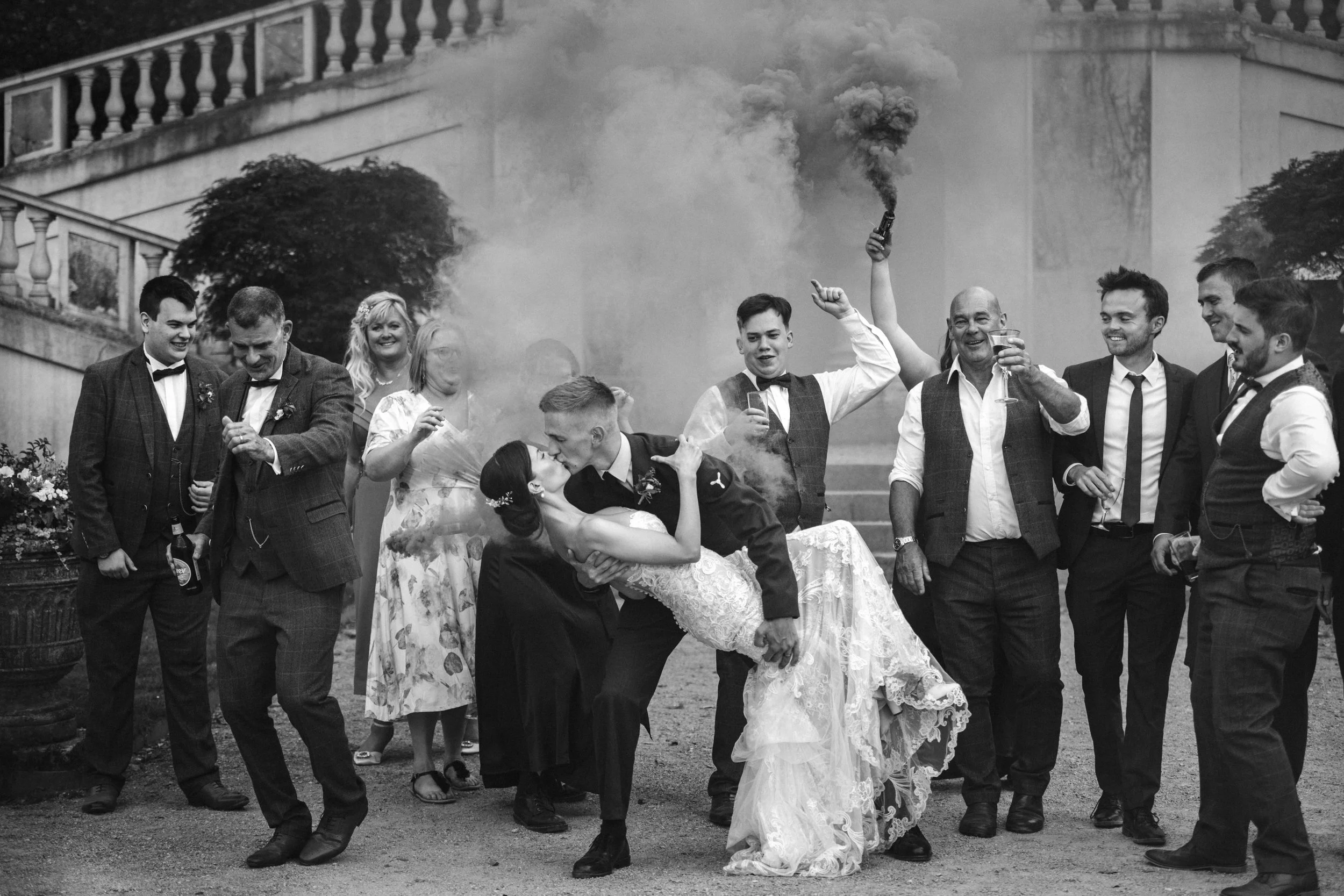 Bride and groom sharing a kiss at The Orangery at Mount Edgcumbe, captured by Cornwall and devon wedding photographer Mark Shaw