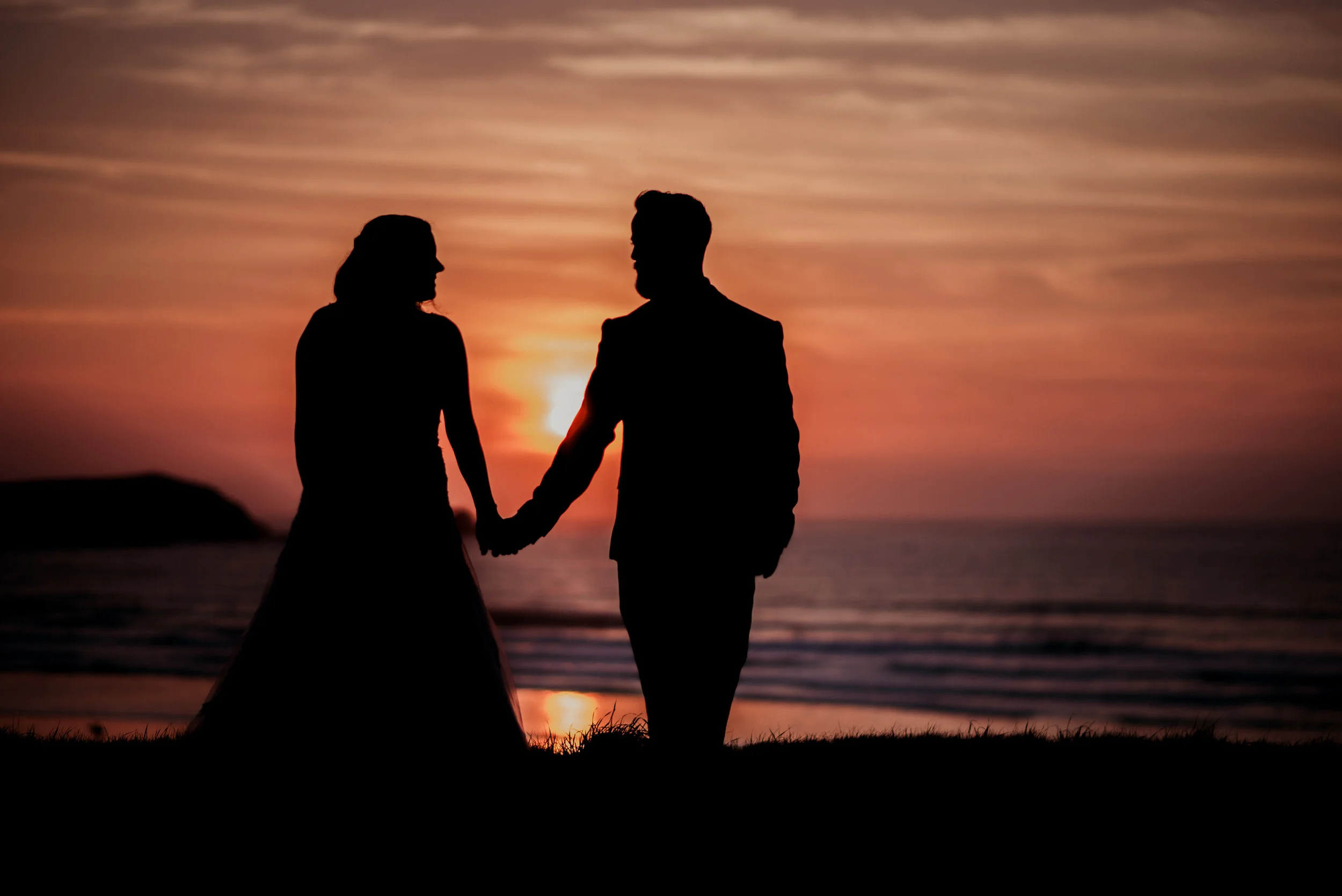 Bride and groom at sunset in Newquay, Cornwall, captured by Cornwall wedding photographer Mark Shaw Photography