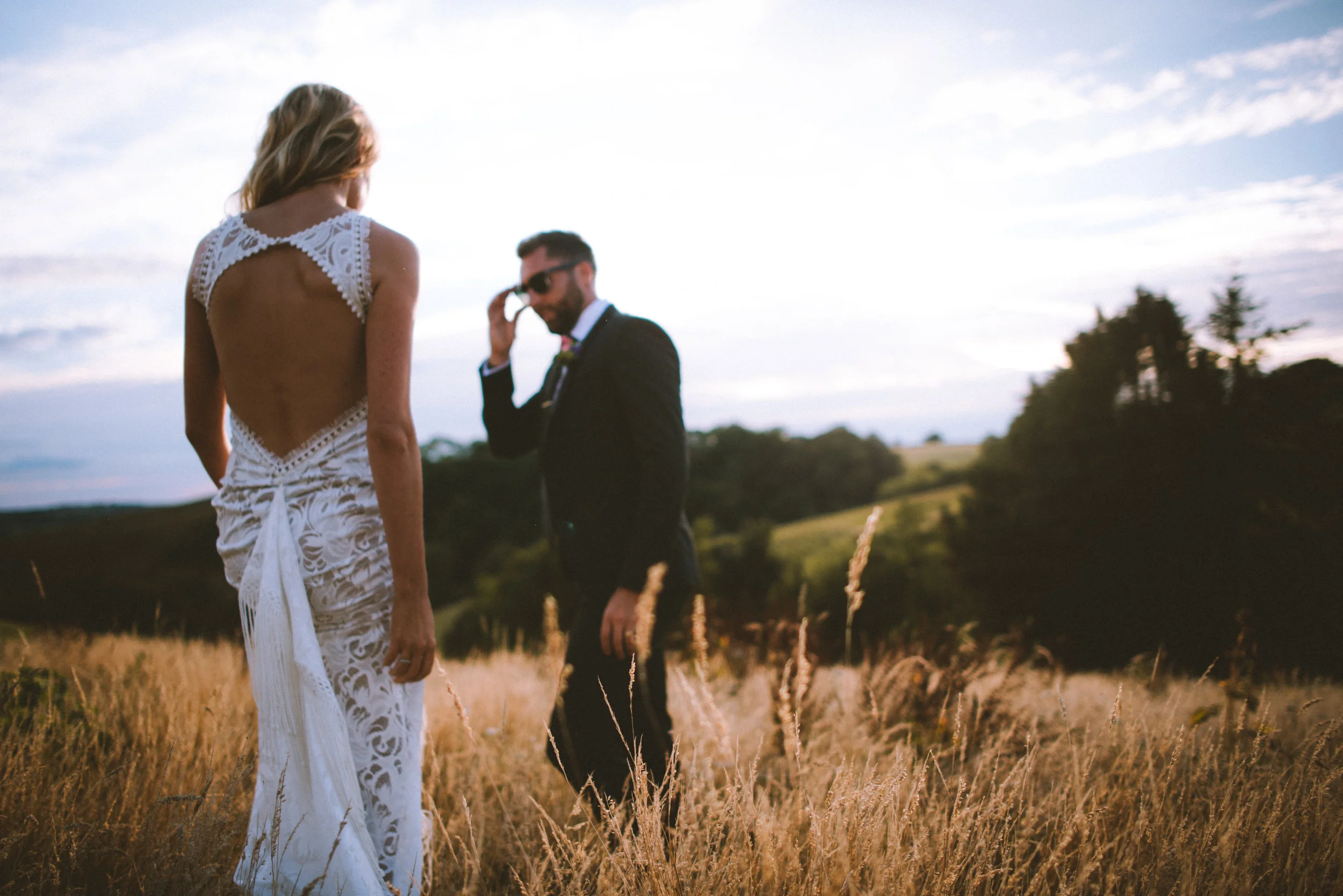 Bride and groom at wedding in Cornwall at sunset golden hour captured by Cornwall wedding photographer Mark Shaw Photography
