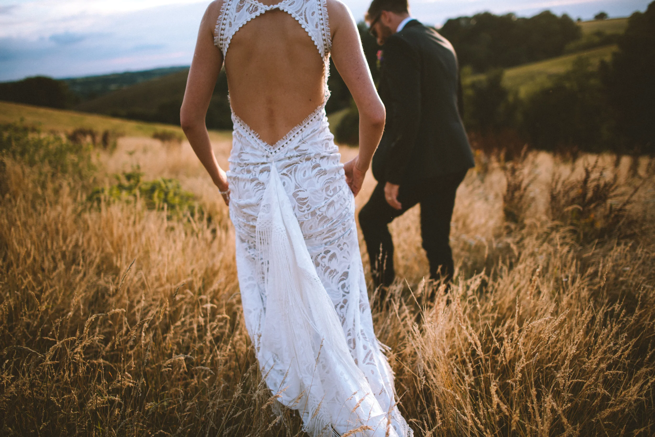 Bride and groom at wedding in Cornwall at sunset golden hour captured by Cornwall wedding photographer Mark Shaw Photography