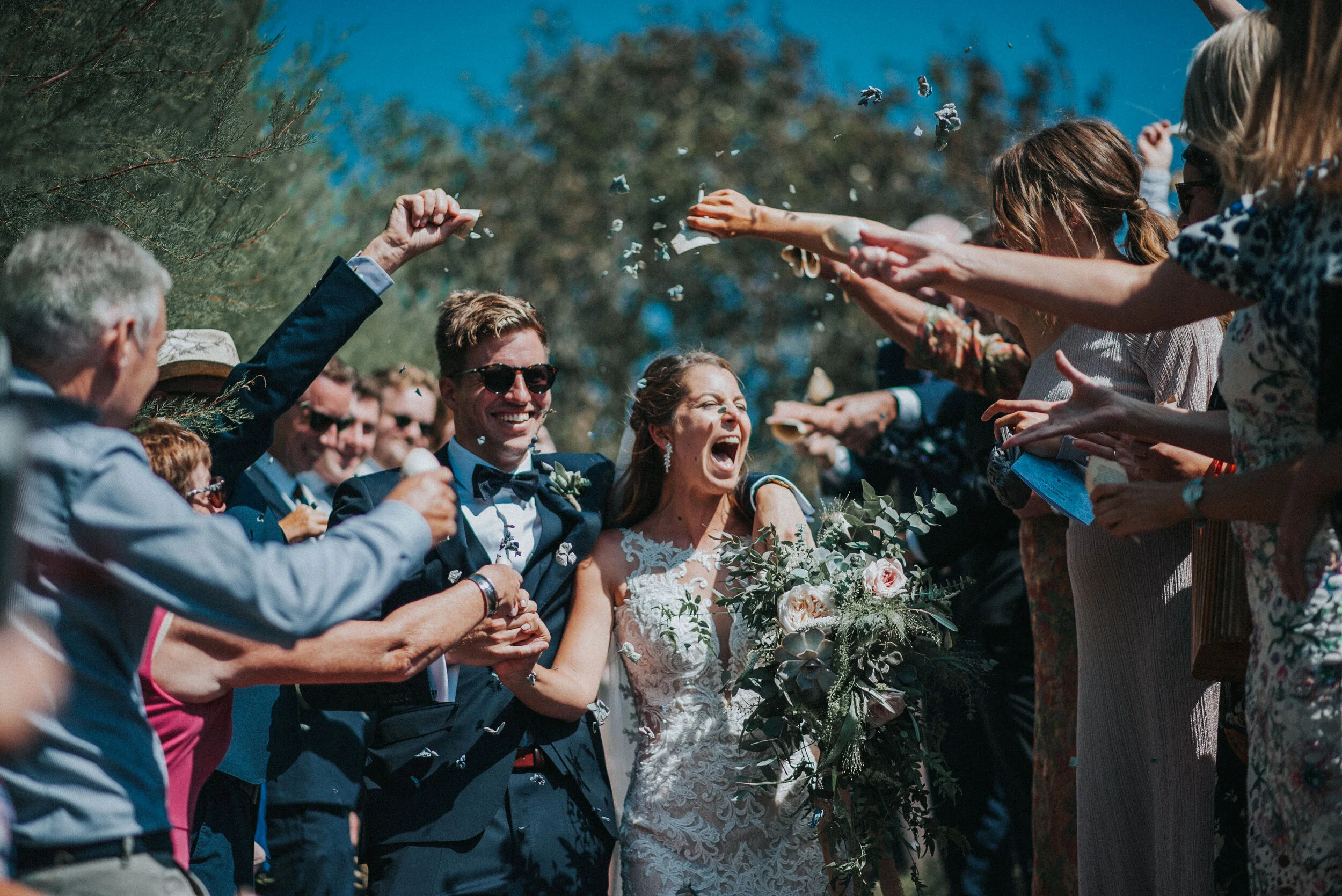 Wedding confetti photo at St Enodoc Church Daymer Bay in Cornwall. 