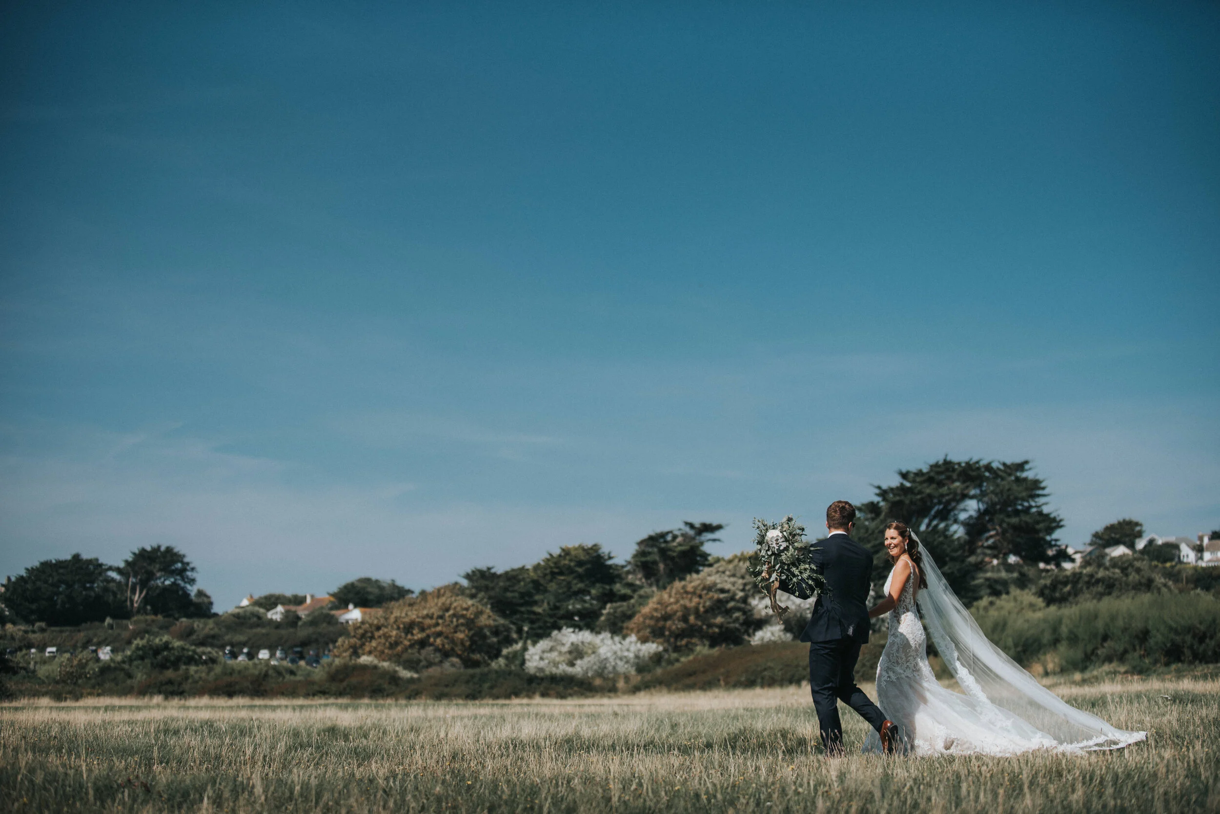 Wedding photo at St Enodoc Church, Daymer Bay in Cornwall. 