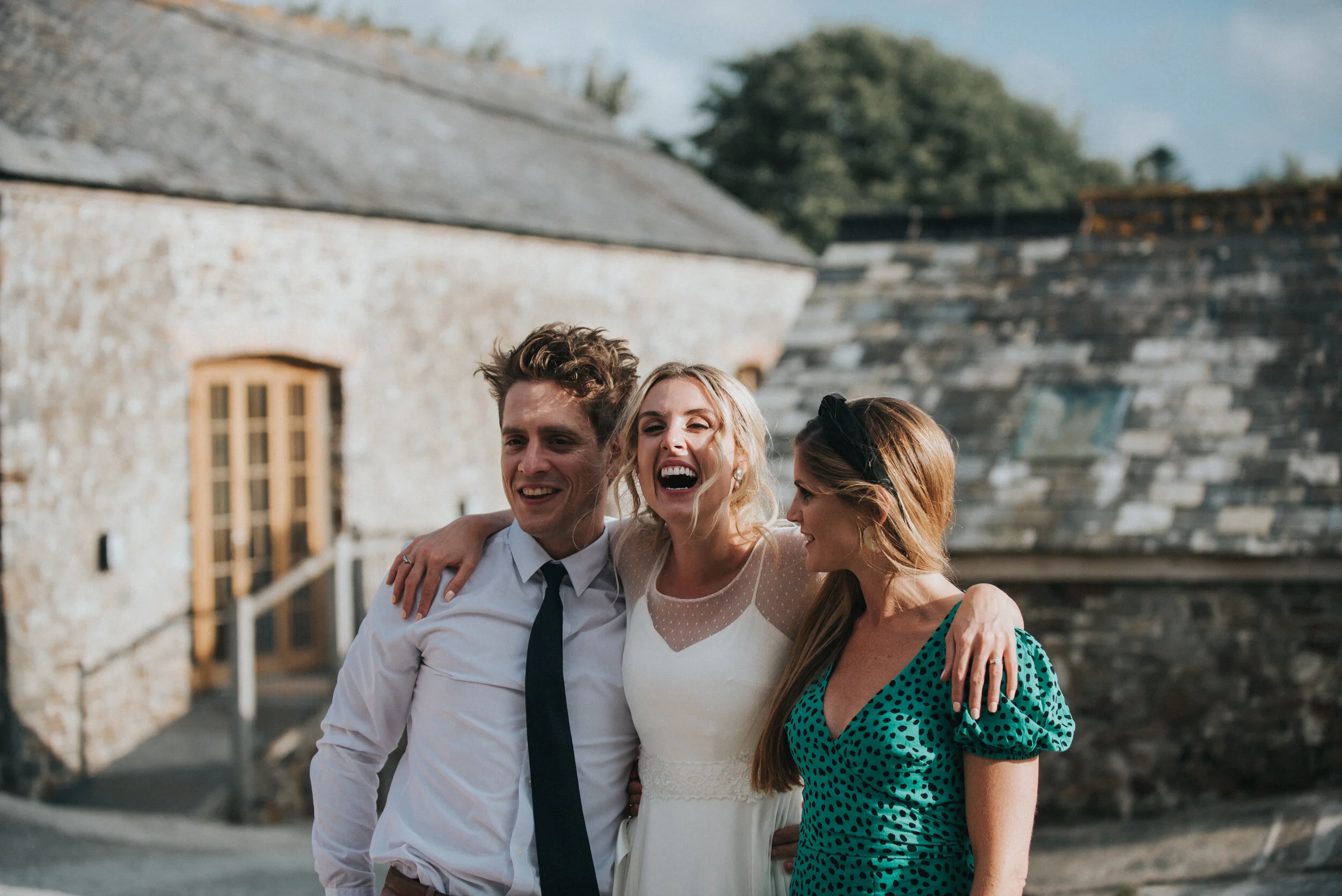 Guests with bride at Launcells Barton in Bude, captured by Cornwall wedding photographer Mark Shaw Photography