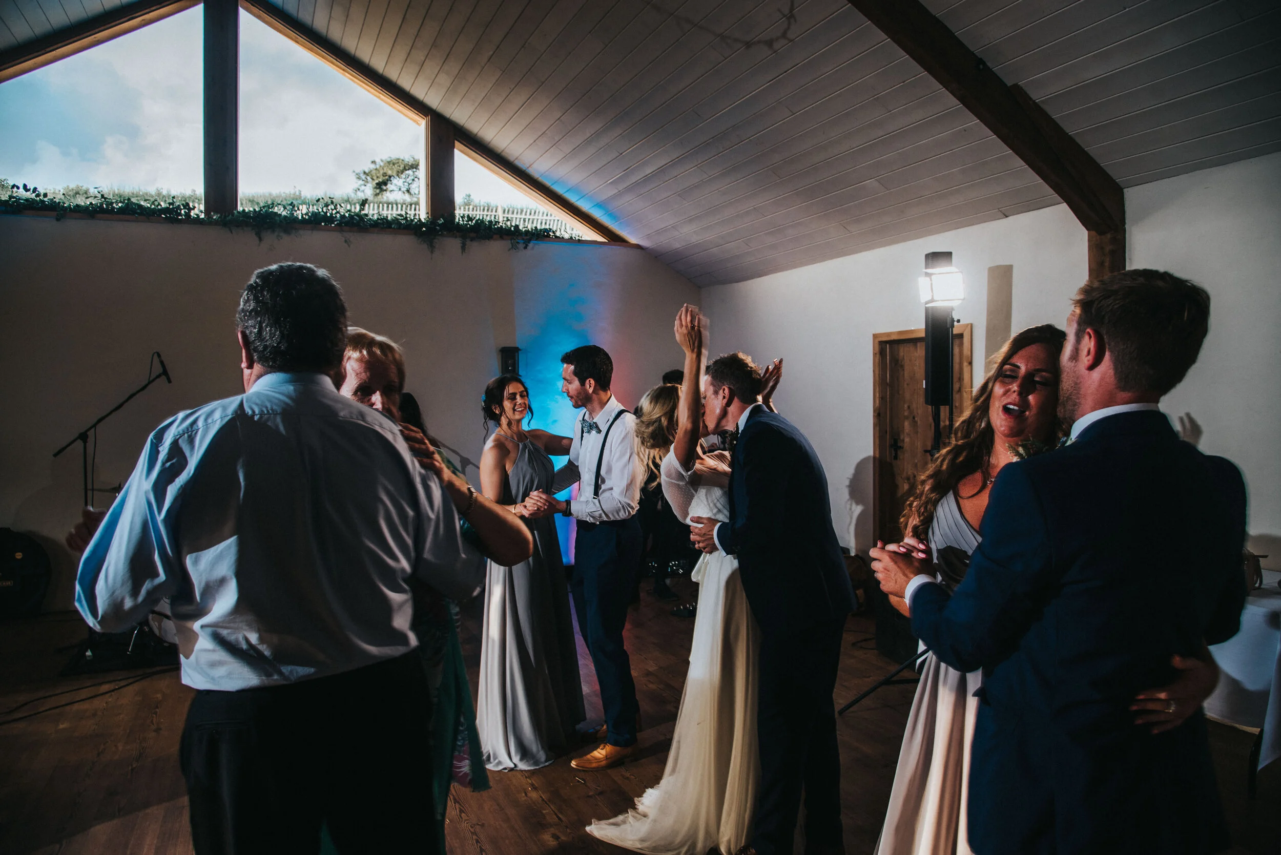 Evening wedding party at Launcells Barton in Bude, captured by Cornwall wedding photographer Mark Shaw Photography