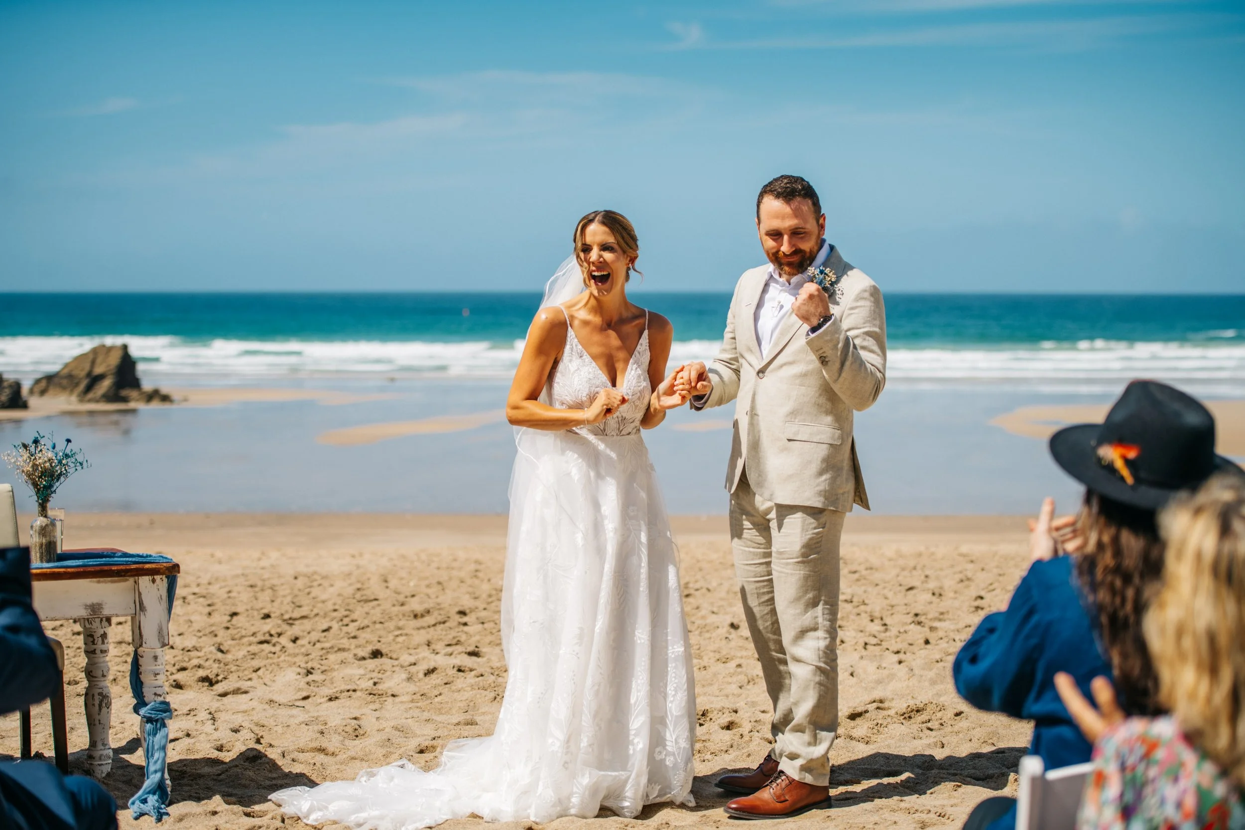 Wedding ceremony on the beach at Lusty Glaze in Cornwall, captured by Cornwall wedding photographer Mark Shaw Photography