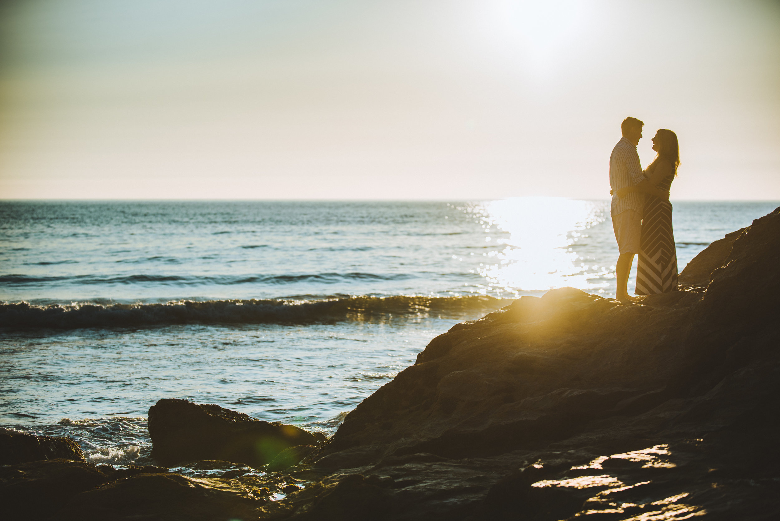 Pre wedding shoot with couple at Gwithian at sunset, captured by Cornwall wedding photographer Mark Shaw Photography
