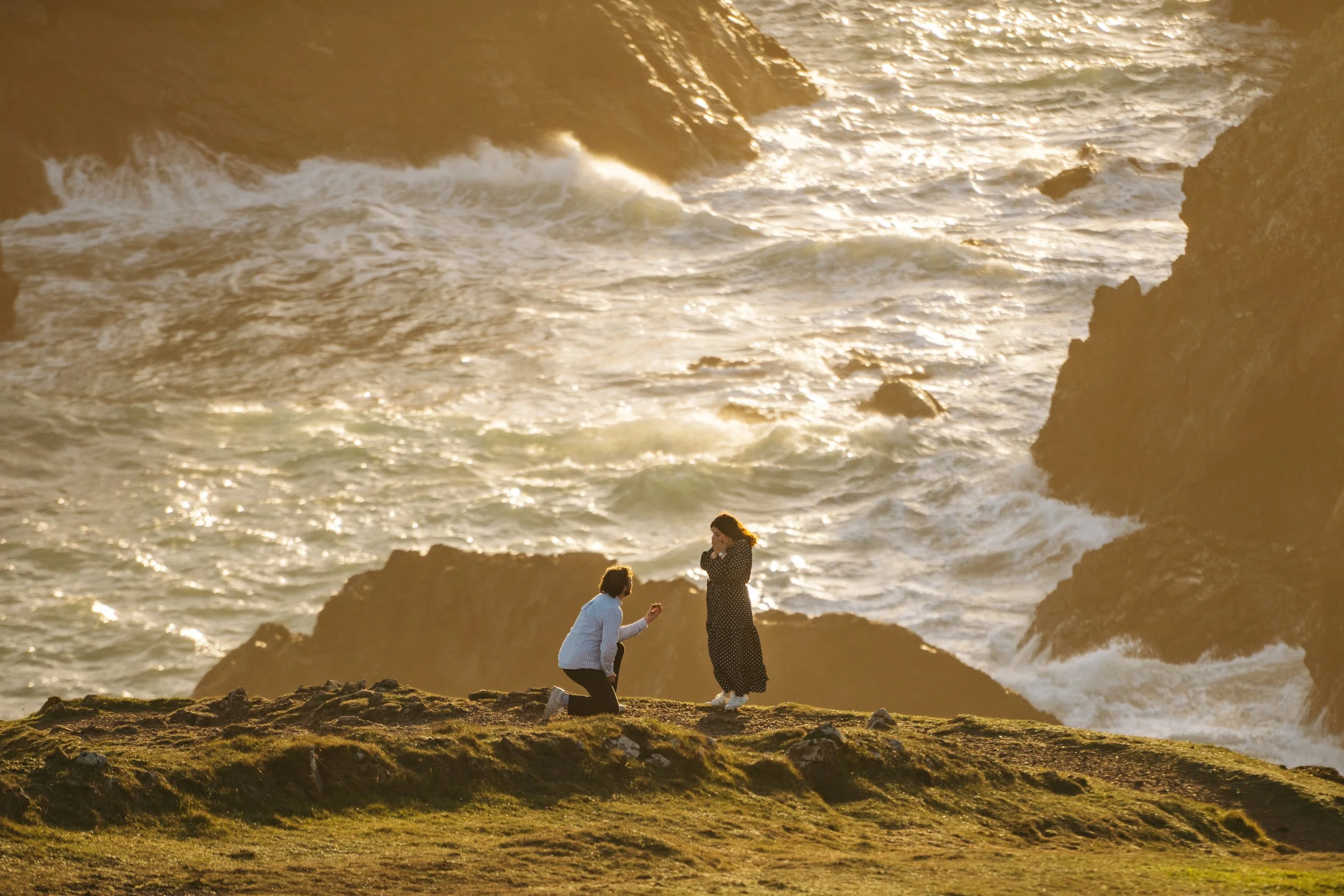 Surprise engagement proposal at Kynance Cove in Cornwall