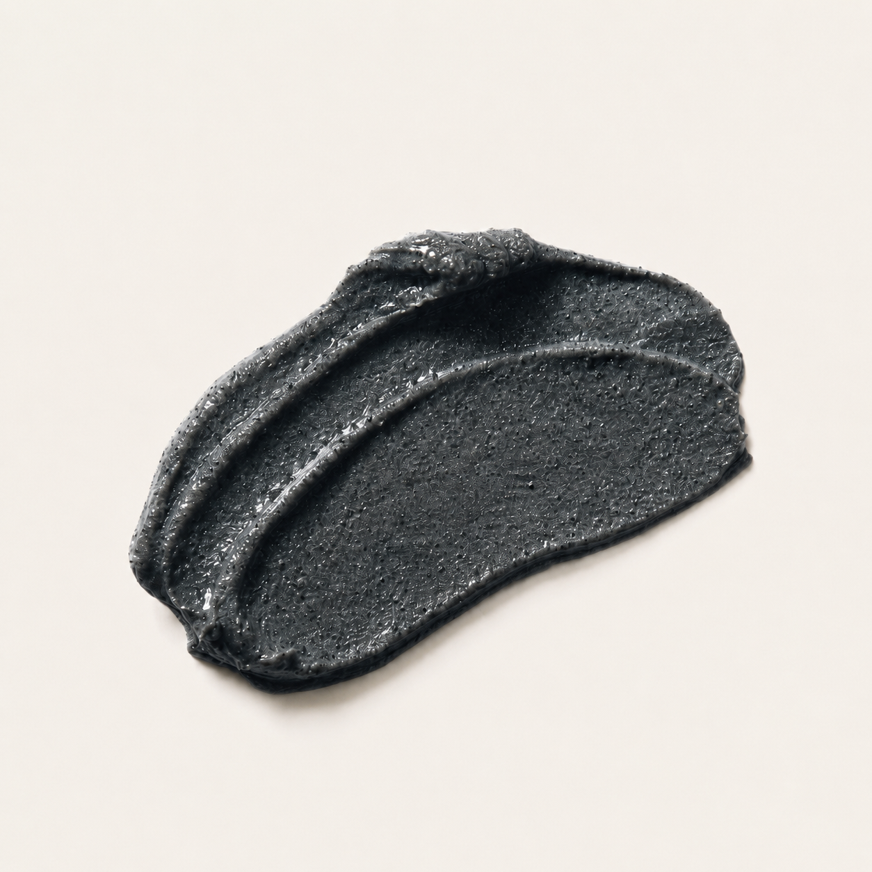 coastline-clear-black-sand-exfoliant-texture.png