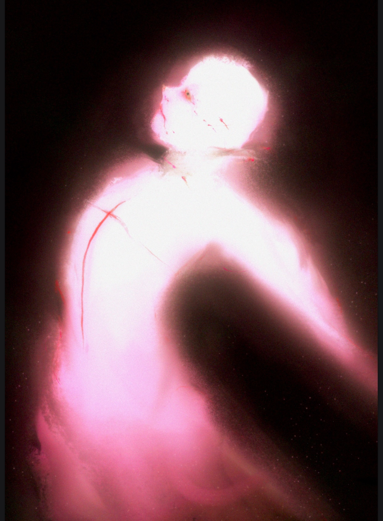 A woman is jumping in front of the camera with her arms bent above her head, illuminated by bright light, creating a glowing silhouette against a dark background.