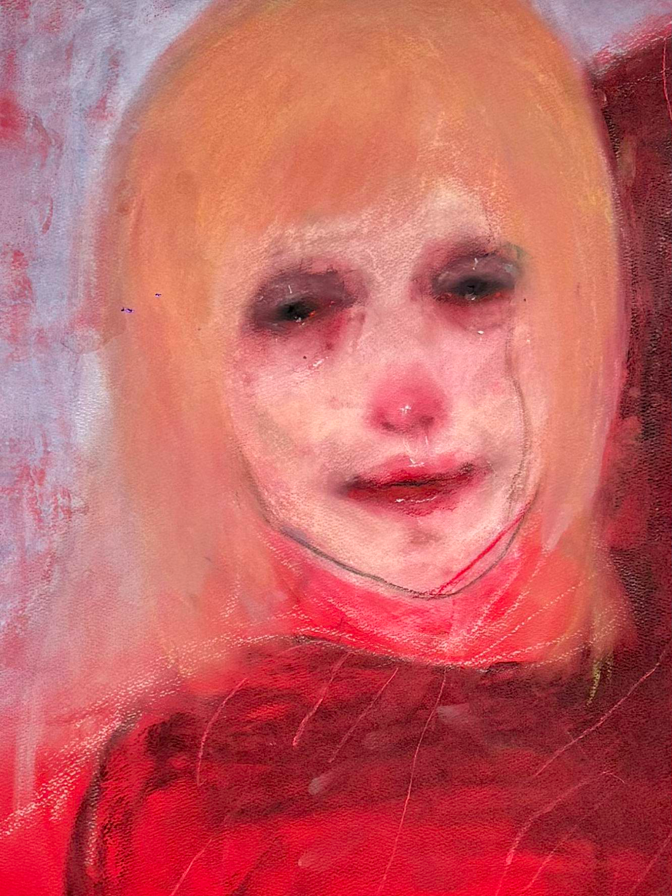 A highly distorted and blurred digital image of a woman's face with dark makeup around her eyes, light skin, and long hair, with red hues.