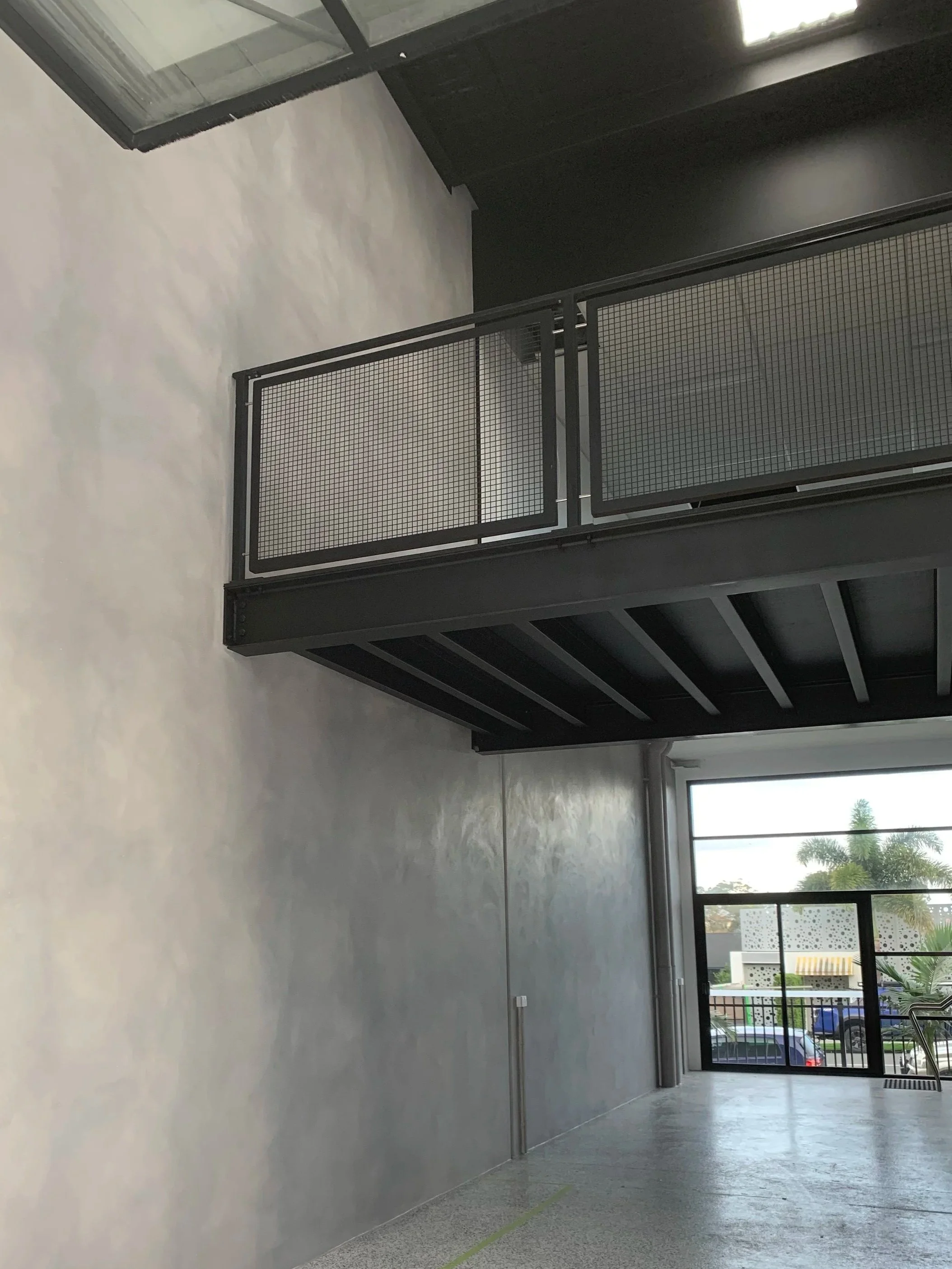 Custom interior painting and concrete-look wall finish for a modern residential property on the Gold Coast. Precision surface preparation and architectural coatings deliver a refined, minimalist aesthetic ideal for contemporary Australian homes.