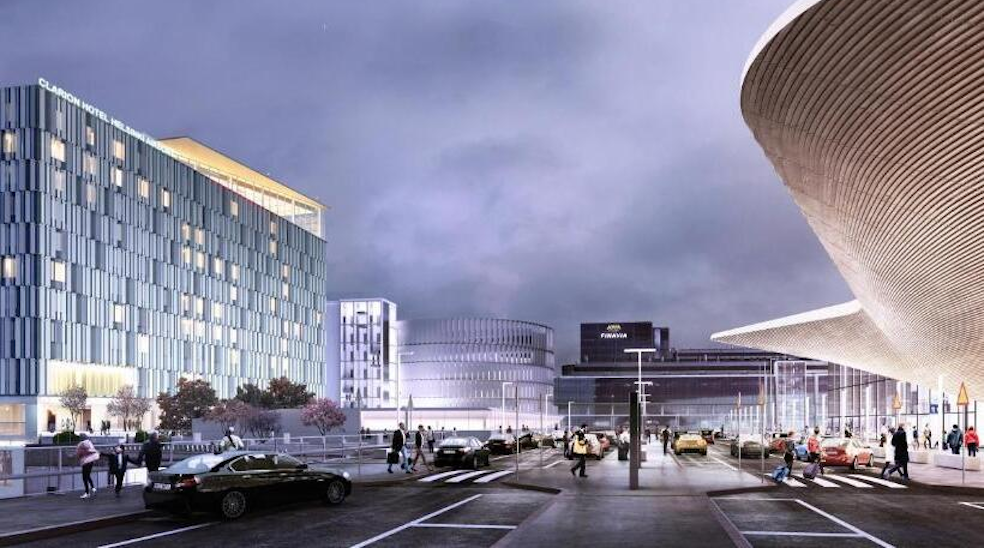 Modern cityscape with large curved architectural building on the right, luxury cars parked in a lot, and people walking nearby at dusk.