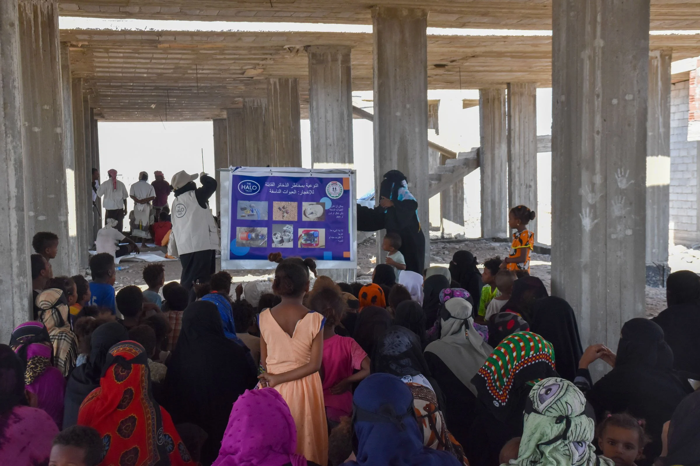 A group of people attend an explosive ordnance risk education session