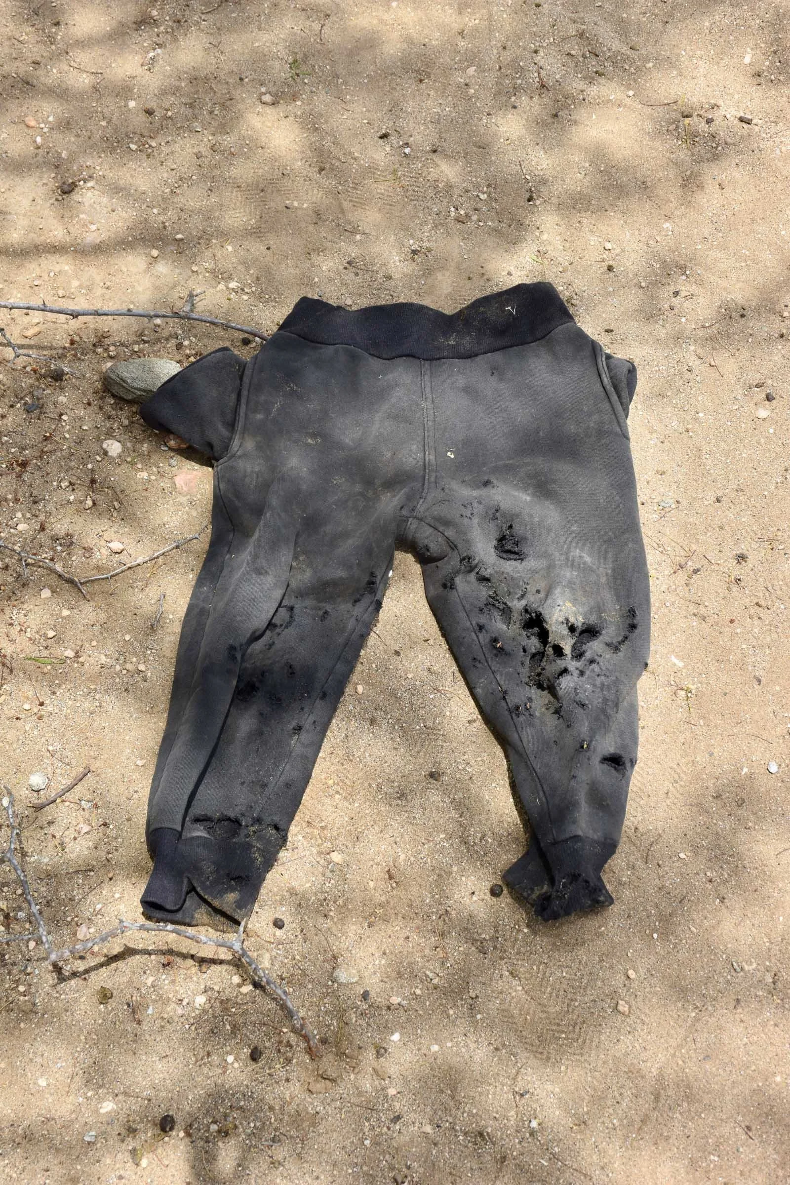 A child's trousers are shredded following an explosion