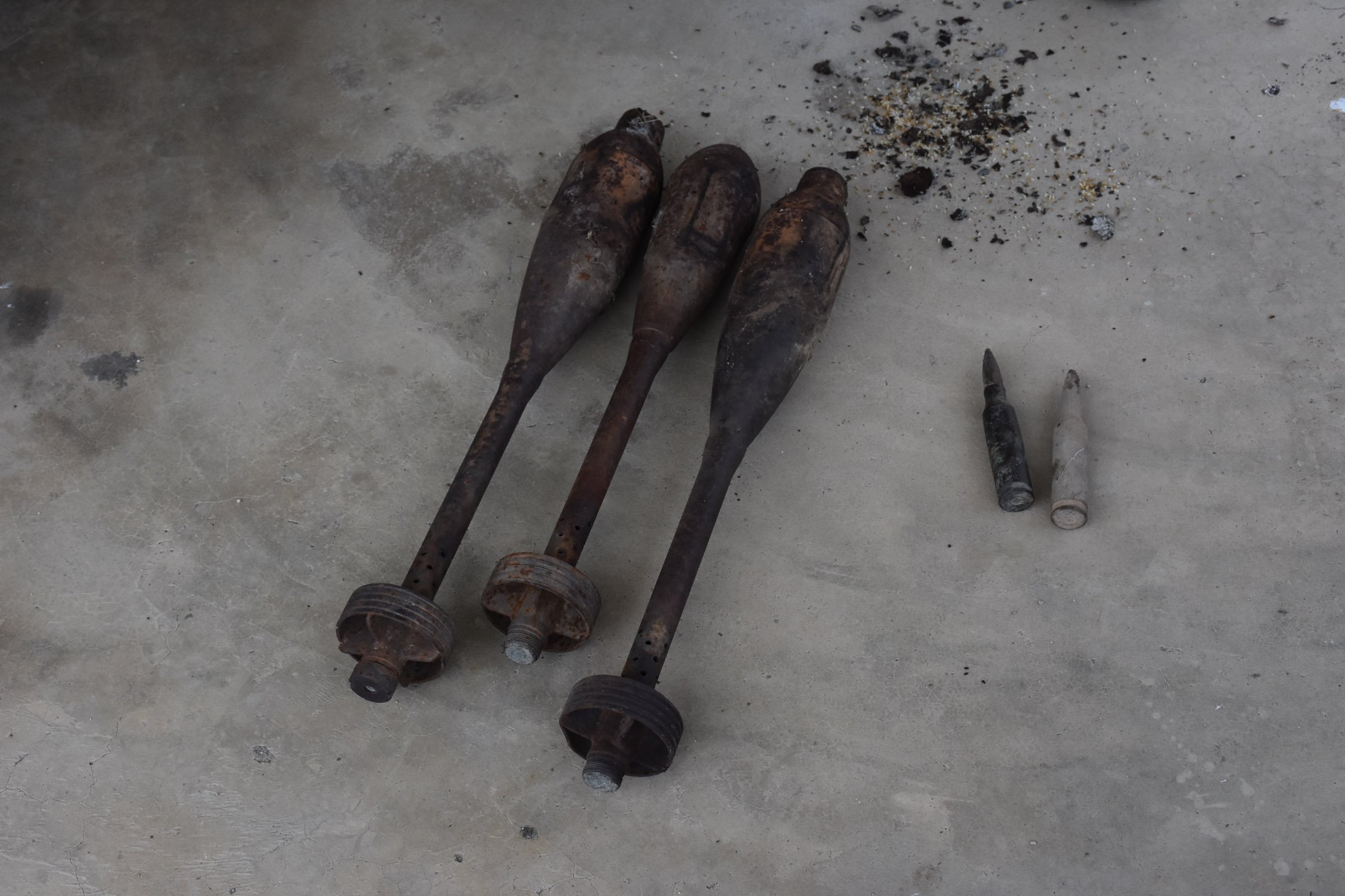 Three projectiles and ammunition