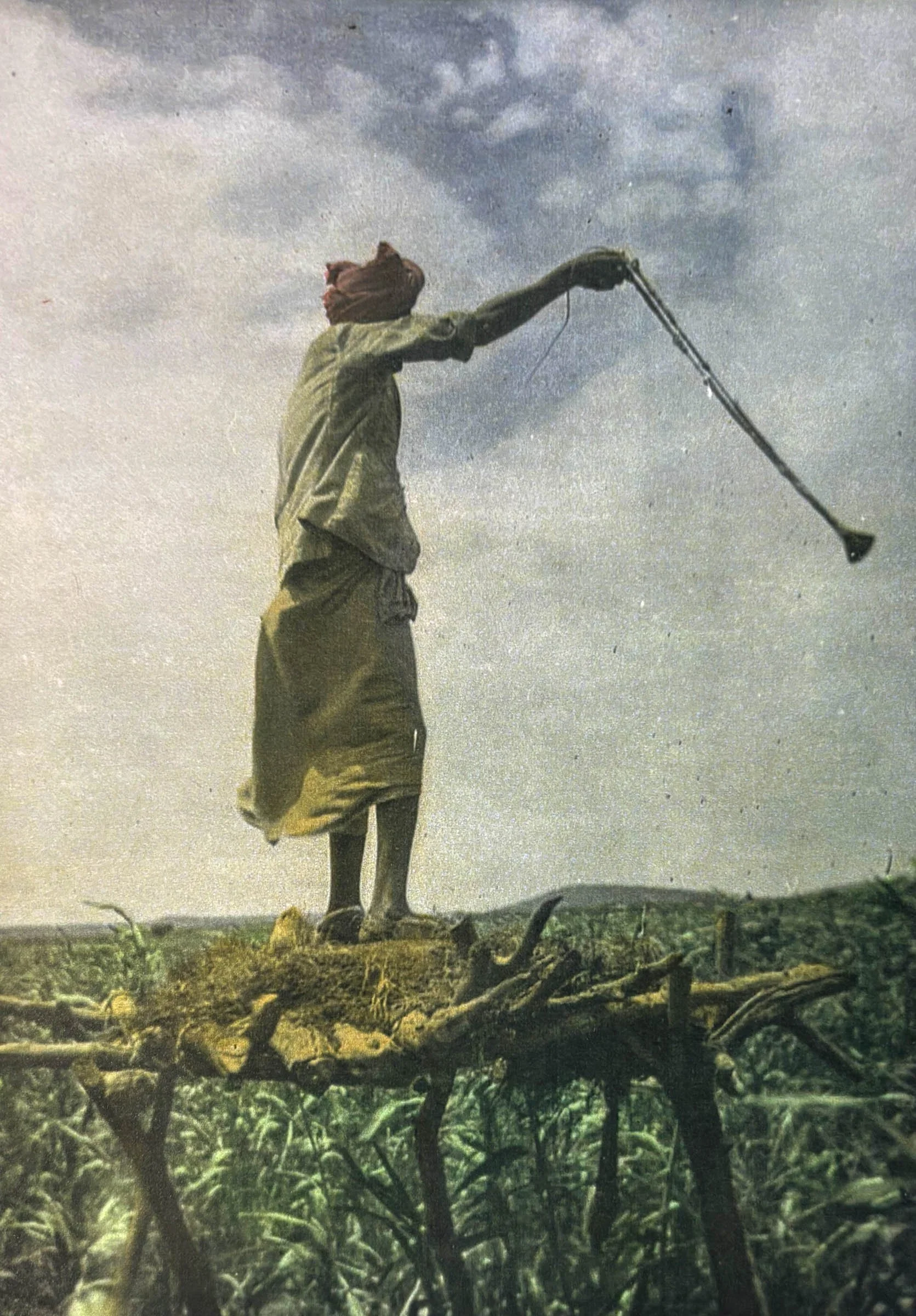 A man swings a catapult, archive photograph by Kenneth Rossi, 1945-1948