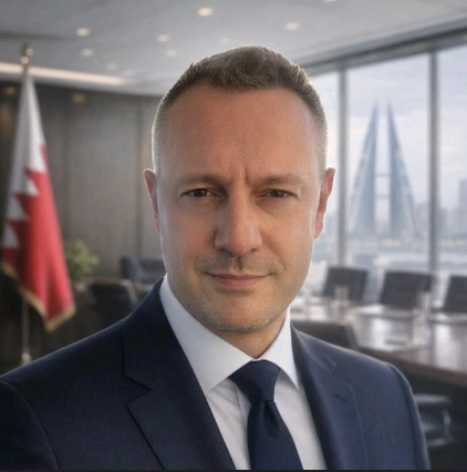 Smiling man in business suit against a dark background