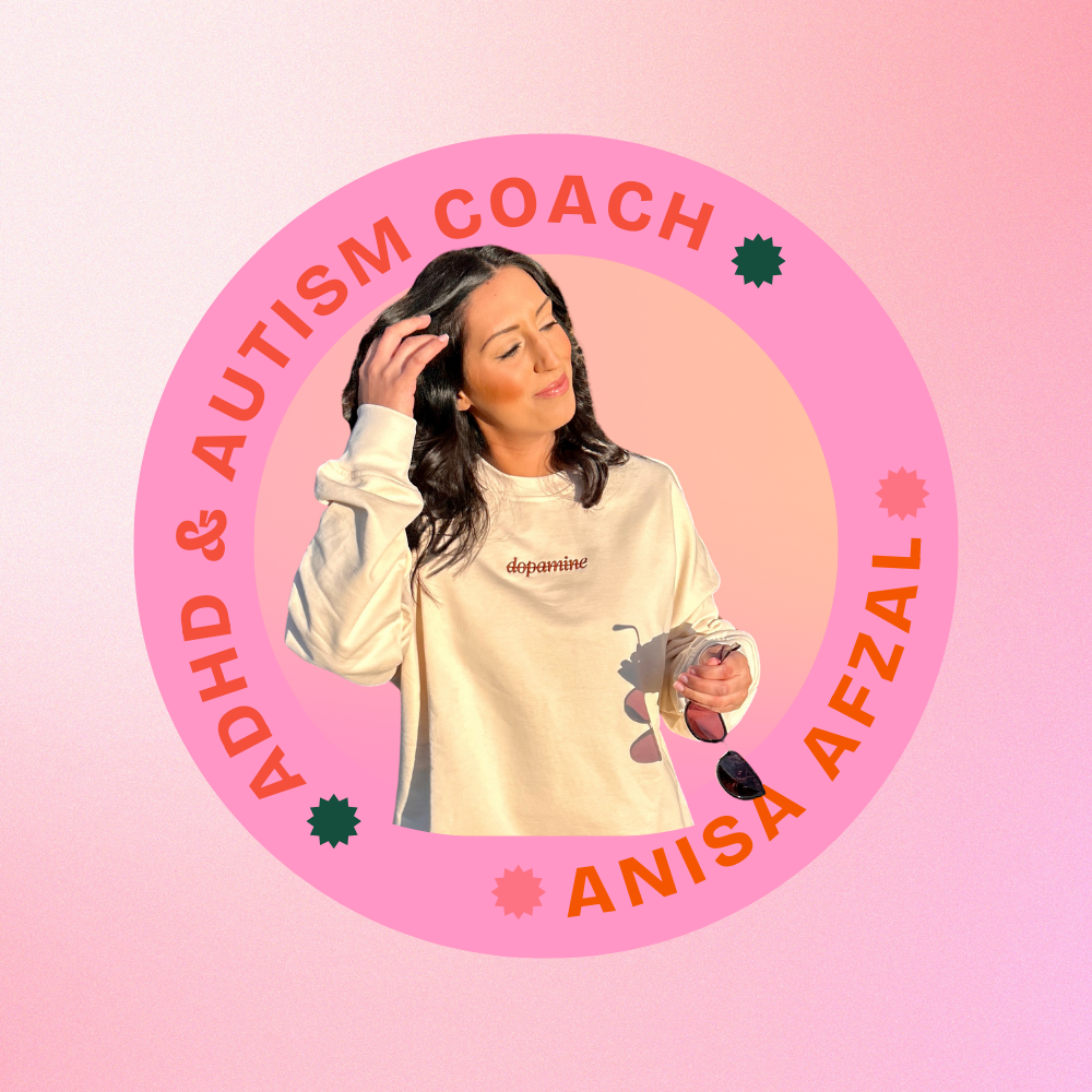 A woman with dark hair scratching her head, wearing a beige sweatshirt with 'dopamine' written on it, standing in front of a pink circular banner that reads 'ADHD & AUTISM COACH ANISA AFZAL' on a pink gradient background.