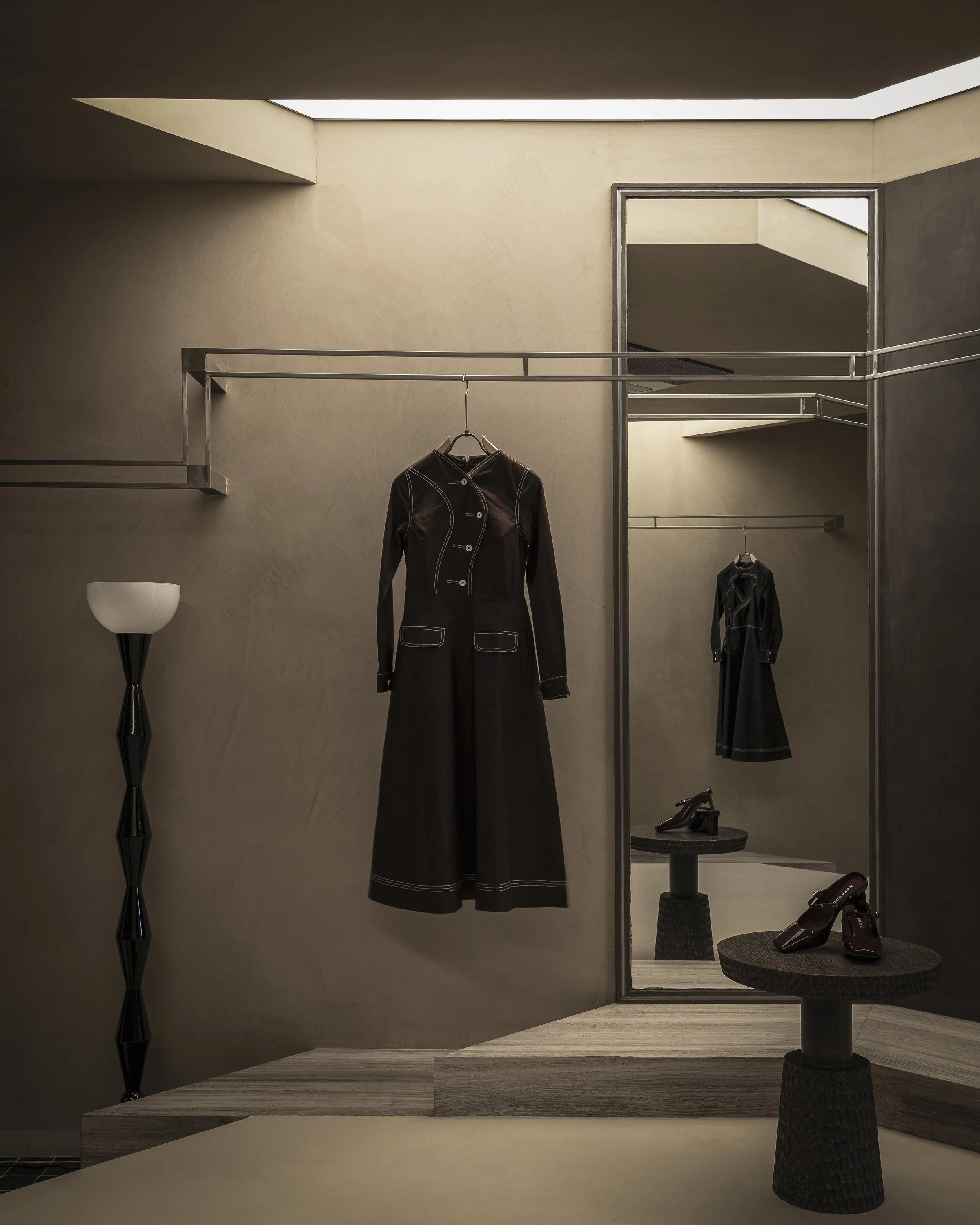 Notebook at Dhan Mill, New Delhi: clothing display and shelving within an angular wall recess