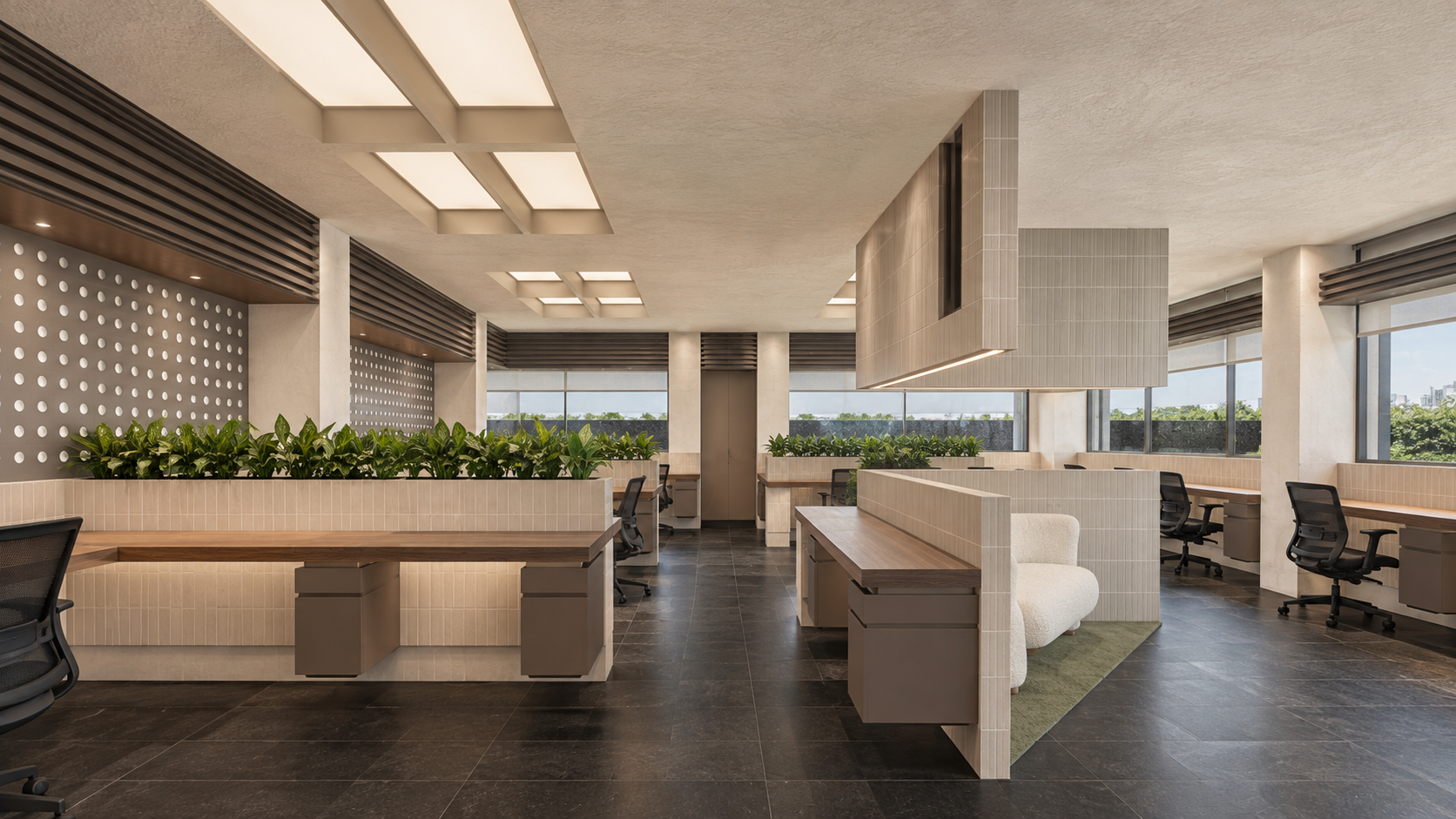 AWC in Noida: shared workspace and lounge seating beneath ceiling light panels