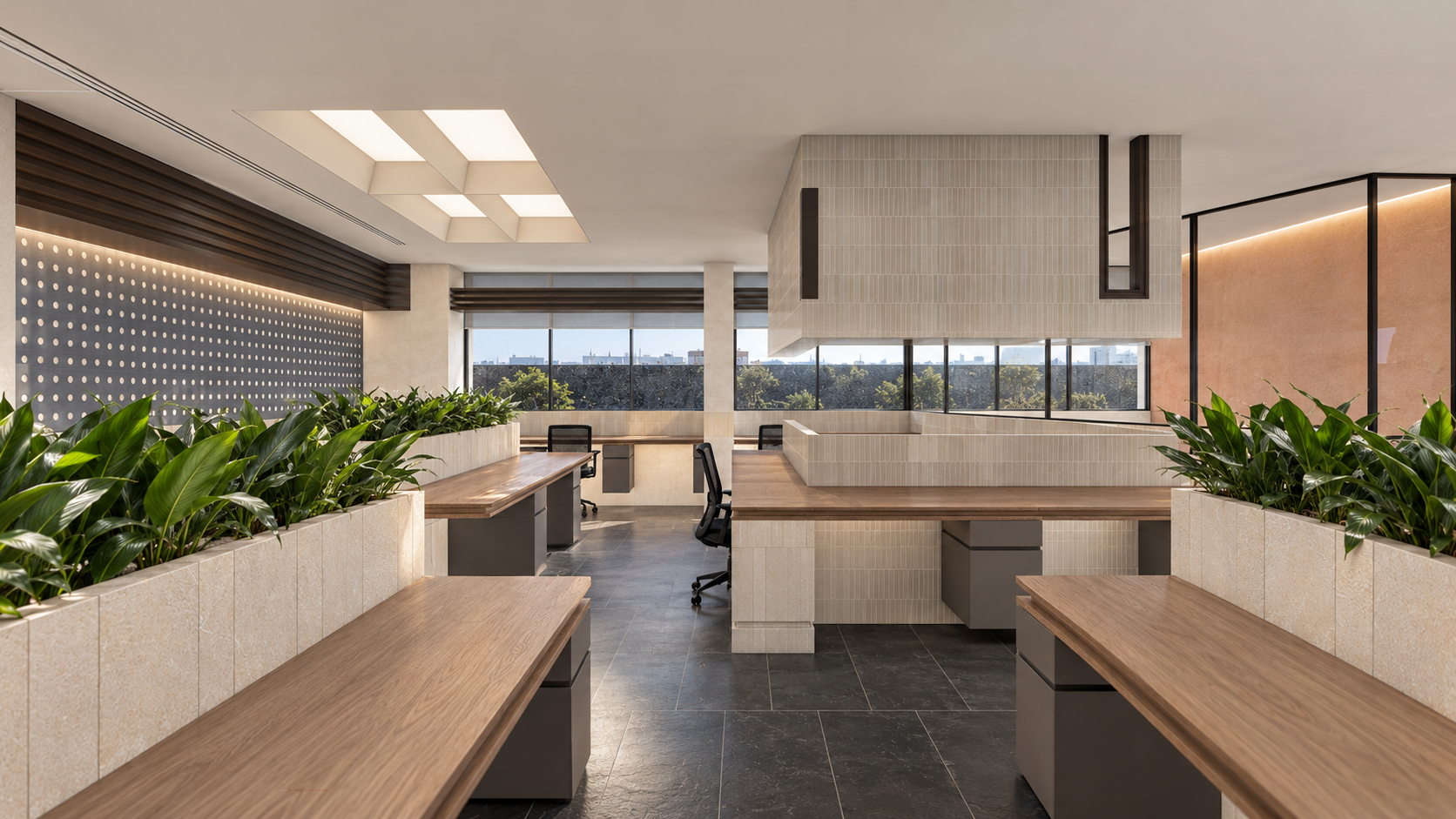 AWC in Noida: planter workstations beside a glass enclosed meeting room