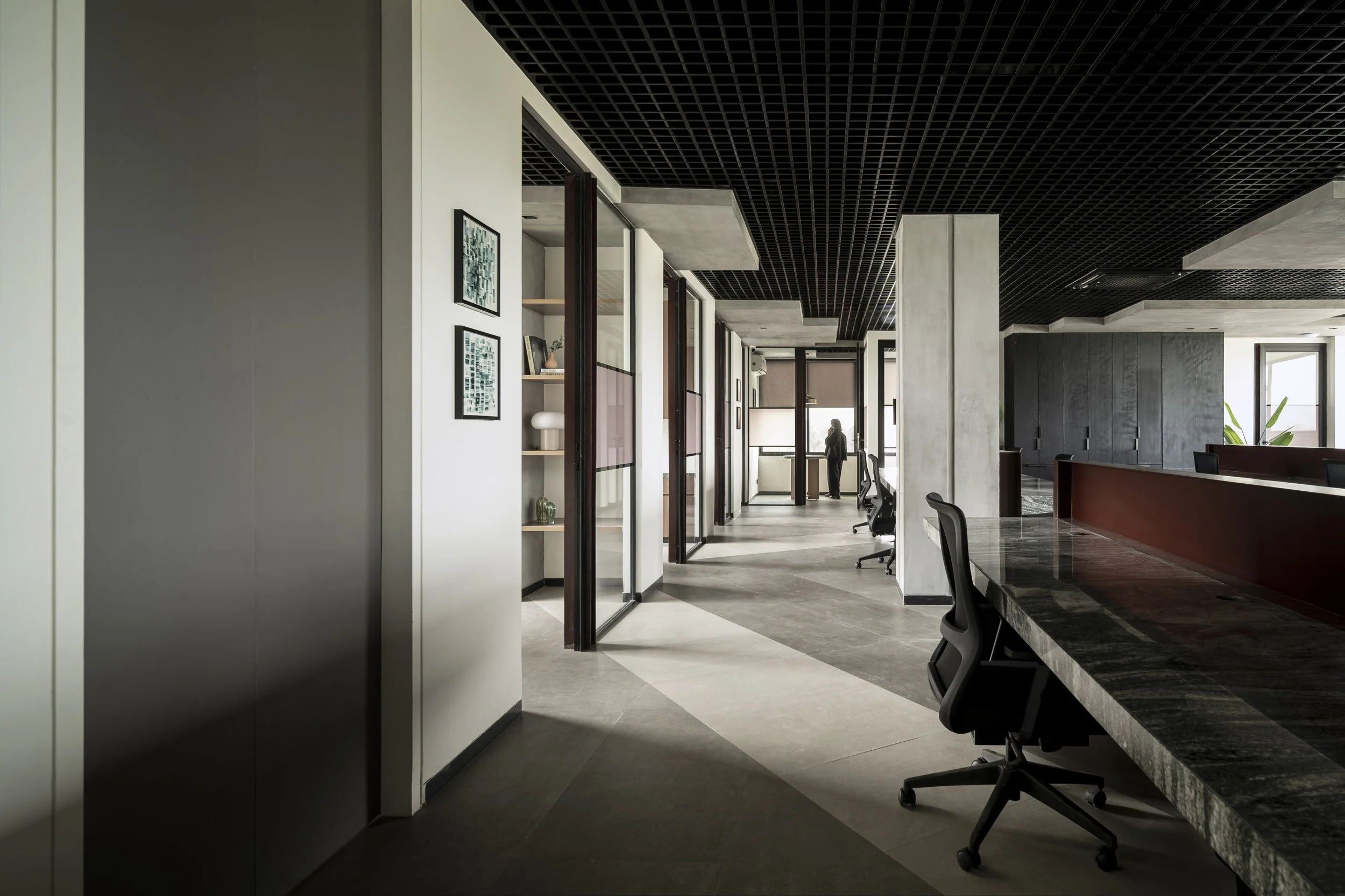 Ironside office in Bangalore: passage overlooking shared workstations and windows
