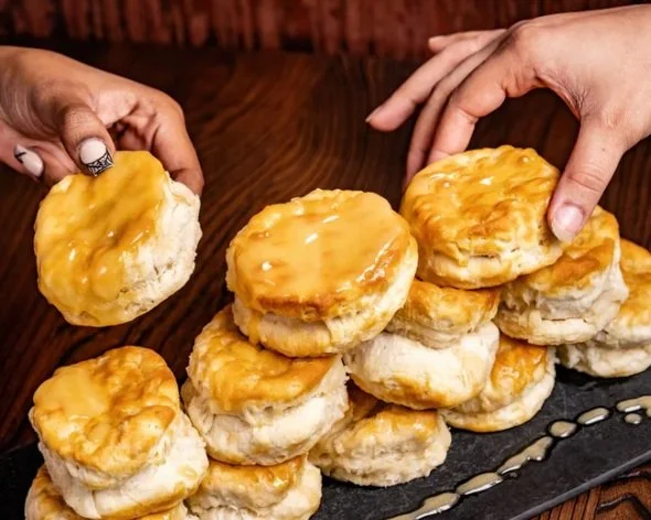 two person holding Honey Butter Biscuits