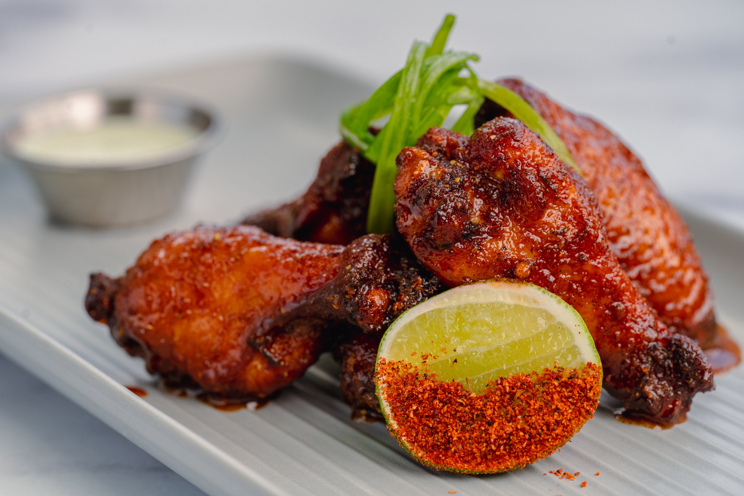 A dish of honey old bay wings