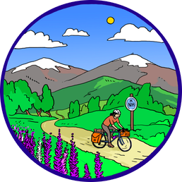 A cyclist riding along a scenic mountain trail with a bicycle, mountains in the background, and a blue trail sign marked 'NH' amidst green trees and purple flowers under a blue sky with clouds and the sun.