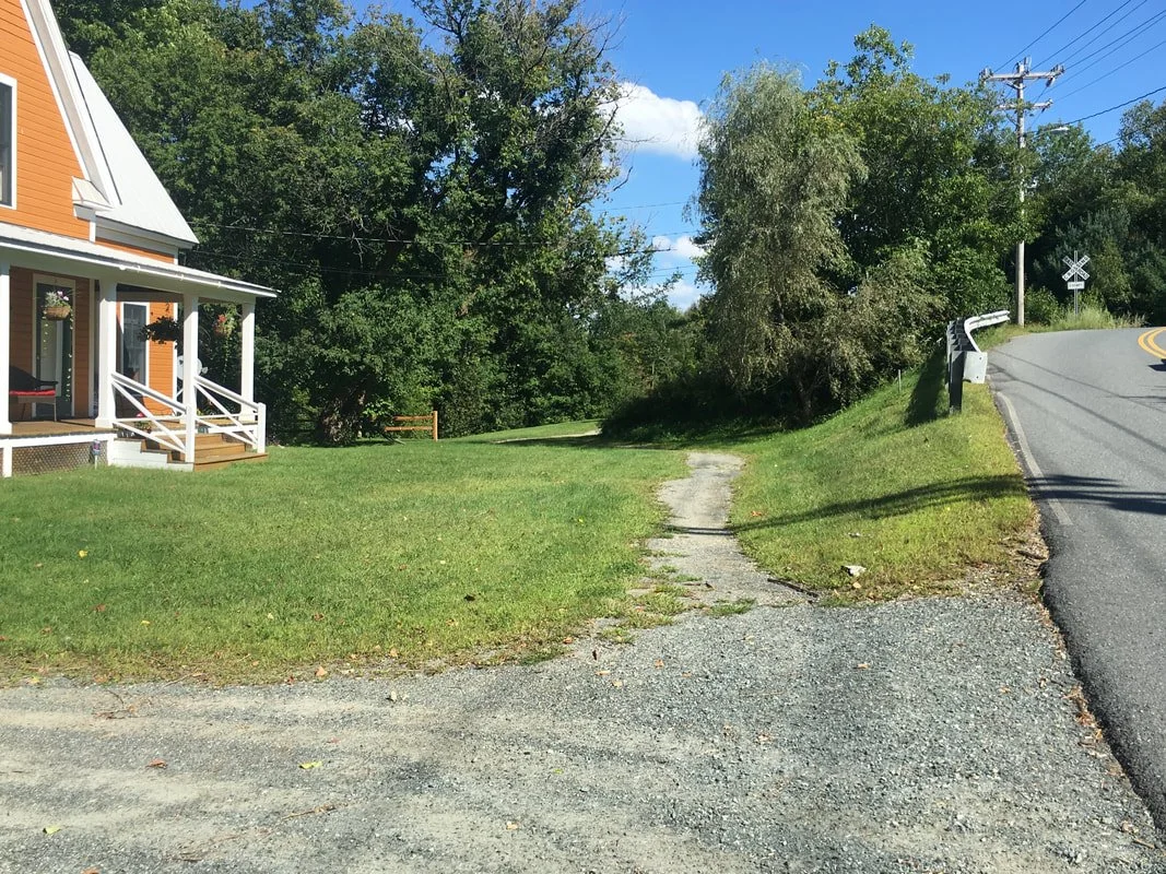 Take this pathway in the front yard of the pumpkin colored house and stay straight to get onto the Littleton Bikeway