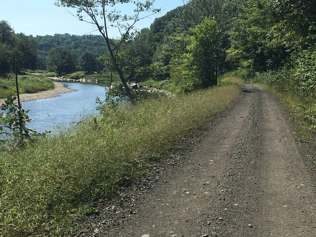 The rail trail can have some loose coarse gravel in this section near Bath.