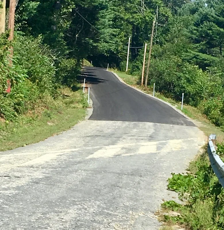 Love it when bad pavement suddenly becomes new black velvet. Bishop Road.