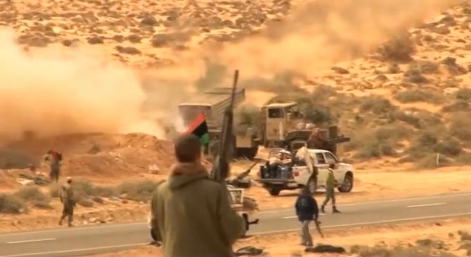 Frontline pictures from Ras Lanuf Libya when the rebels came under very heavy artillery and mortar fire from Gadaffi's troops. March 2011. Filmed by Daniel Demoustier for ITN