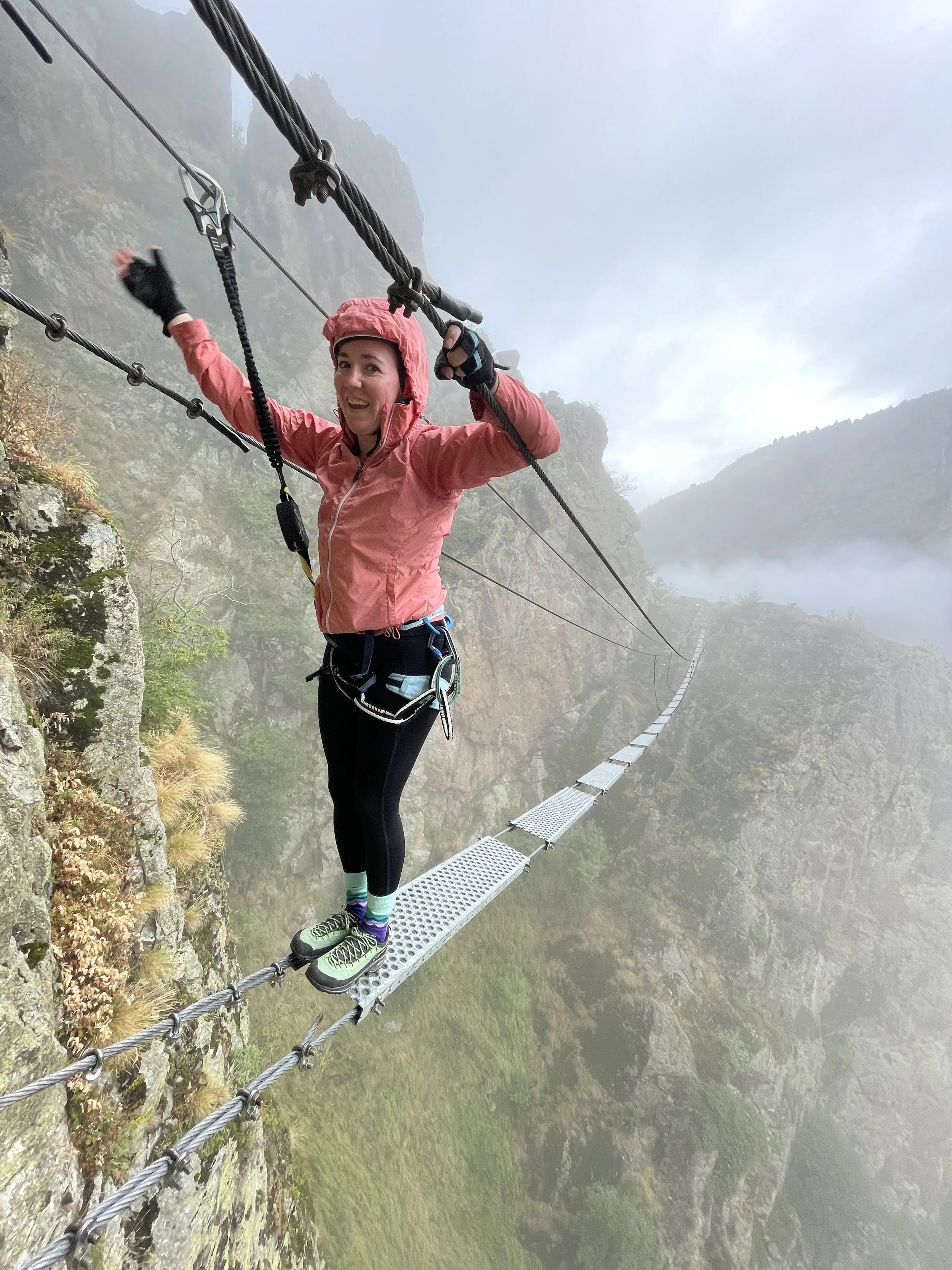 A swinging bridge over a small gorge on a via ferrata in the Pyrenees provides an adrenaline rush and is a fun addition to an adventurous European vacation.